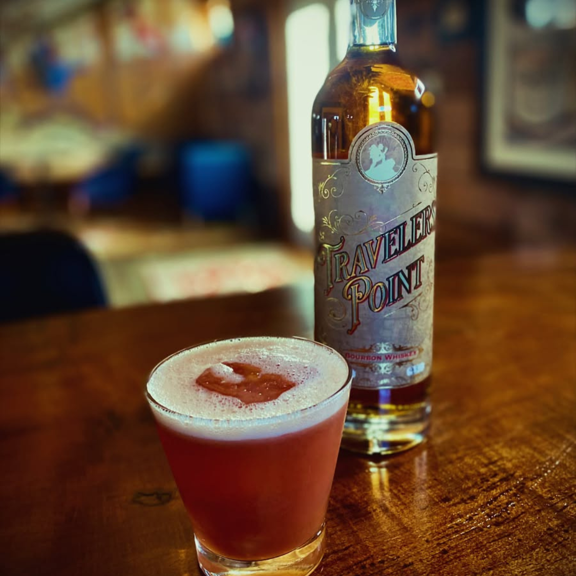Bourbon bottle and cocktail