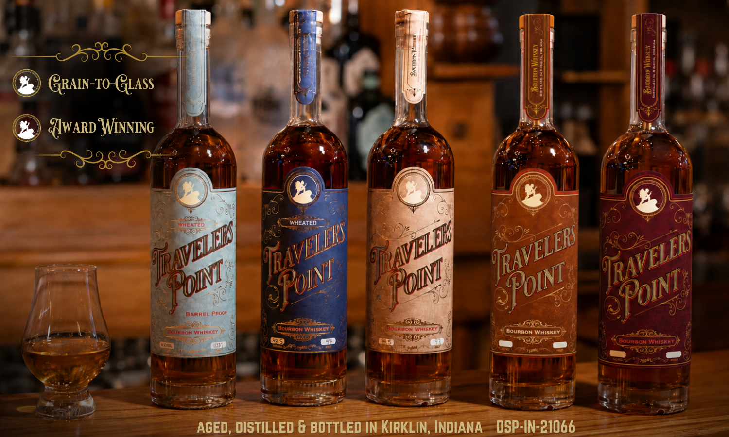 Five Travelers Point Bourbon bottles on a bar top