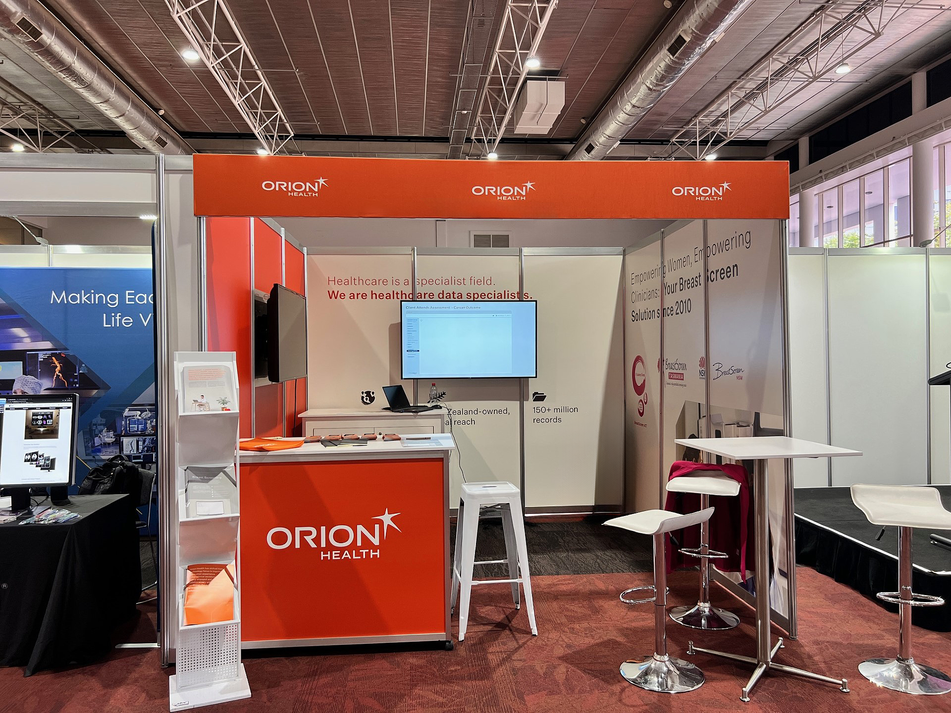 Octonorm 3m x 3m Booth with Printed Graphics, Banner Fascia, AV & Furniture