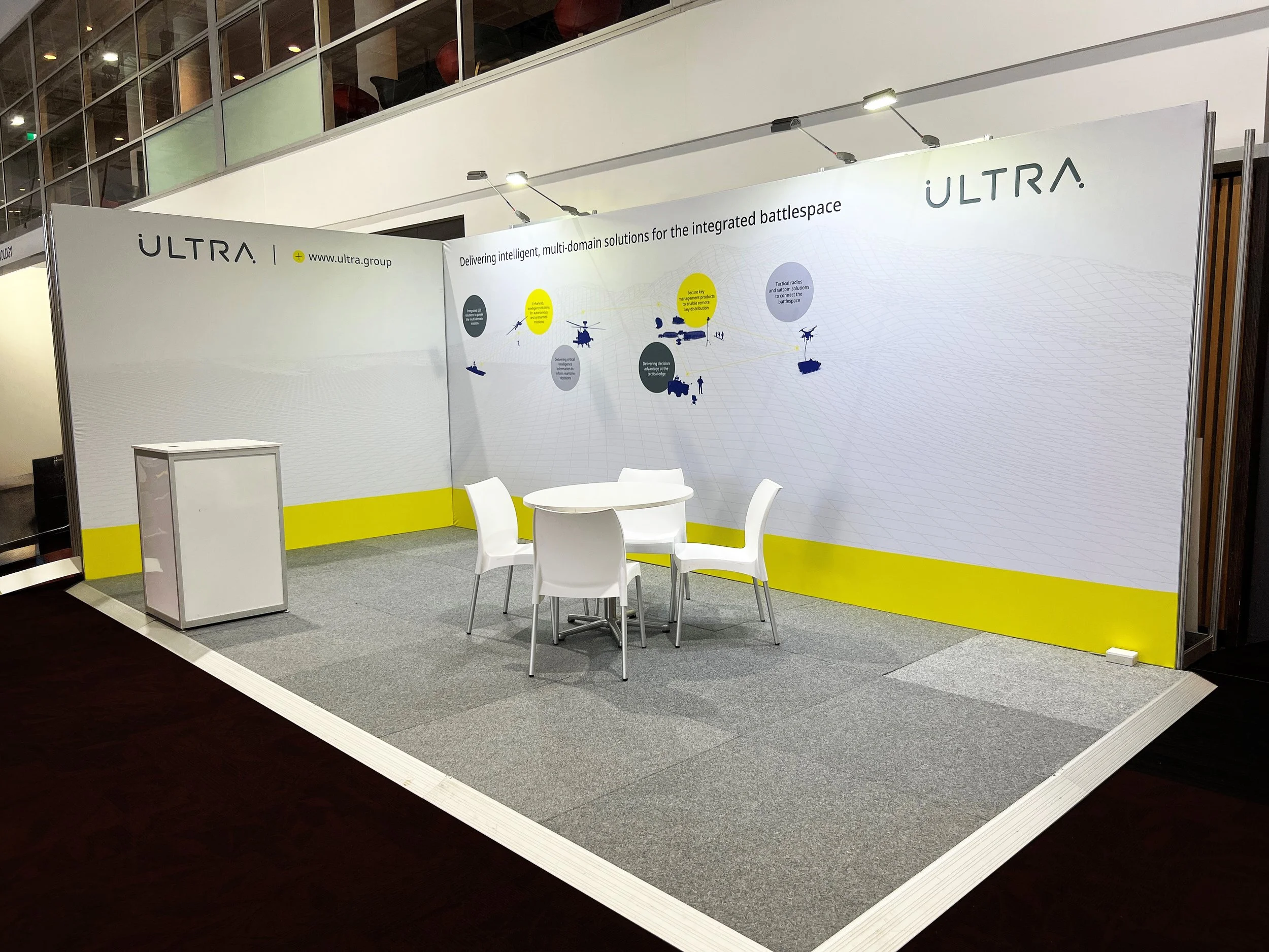 MP stand with reframe banners, furniture & flooring