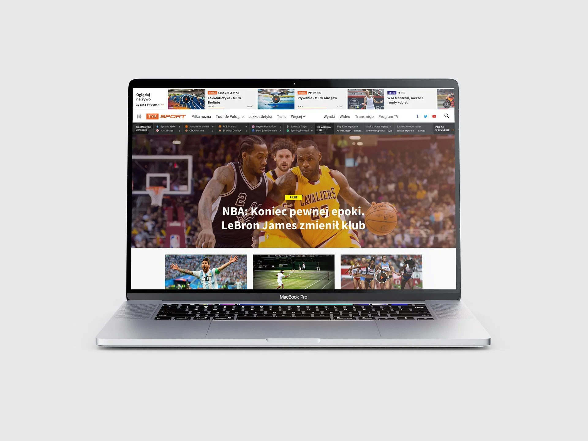 A MacBook Pro displaying a sports news website with images and headlines, including basketball and tennis.