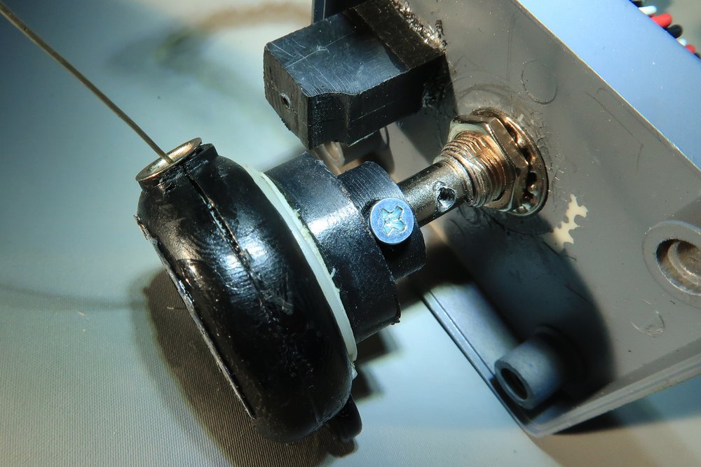   Another view showing the screw that attaches the spool to the shaft of the potentiometer.&nbsp; In the image, the spool has yet to be pushed onto the shaft.&nbsp; The screw hole in the shaft can be seen in addition to the screw that secures the spo