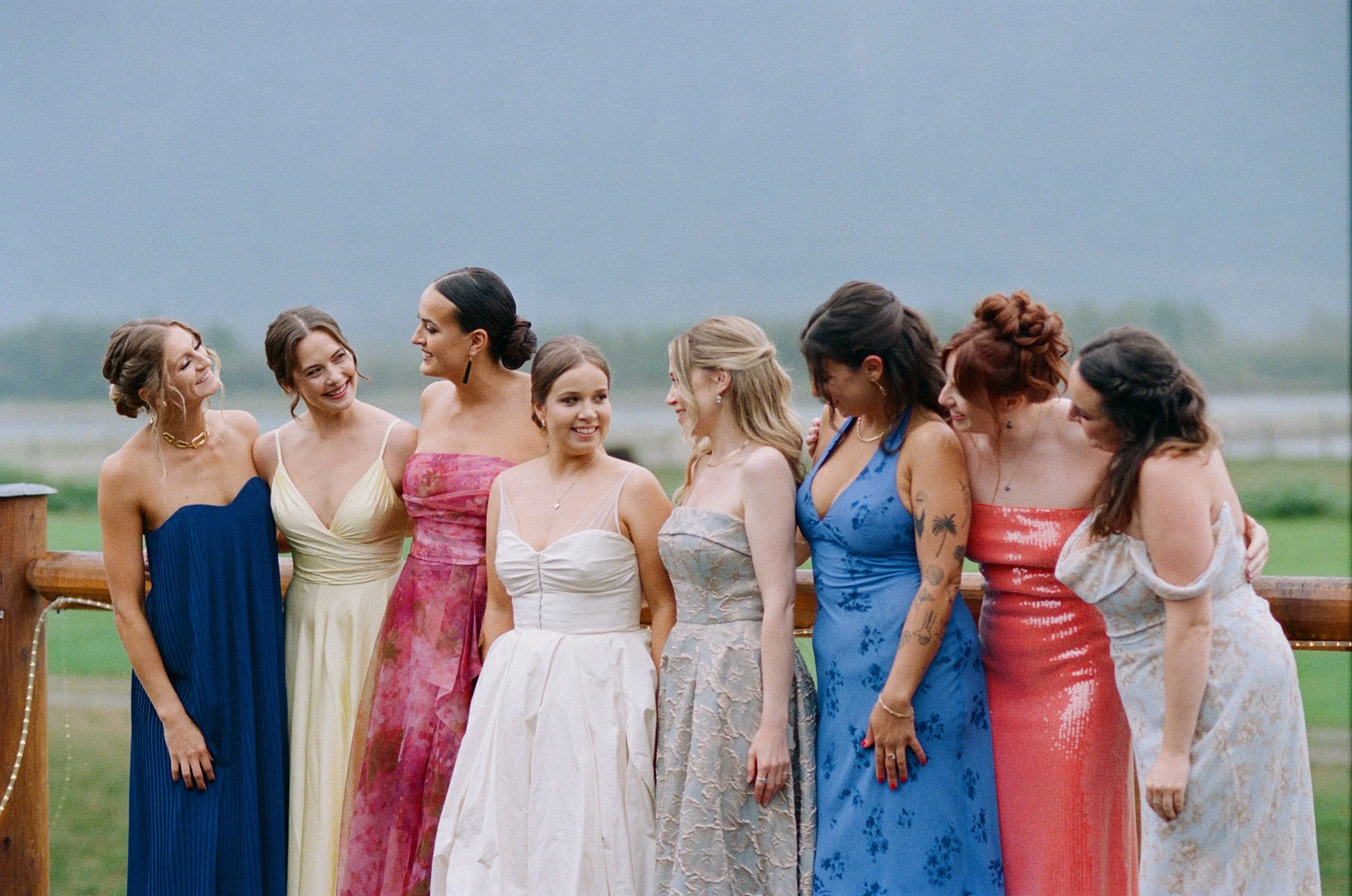 Fun wedding party moments at Fraser River Lodge — champagne cheers, laughter and candid guest reactions photographed with film and digital cameras.