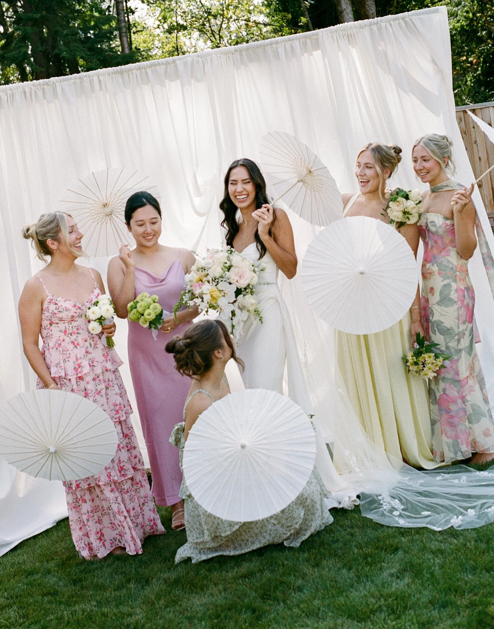 Wedding party portraits photographed against custom white drapery backdrop at private estate backyard wedding in Langley British Columbia