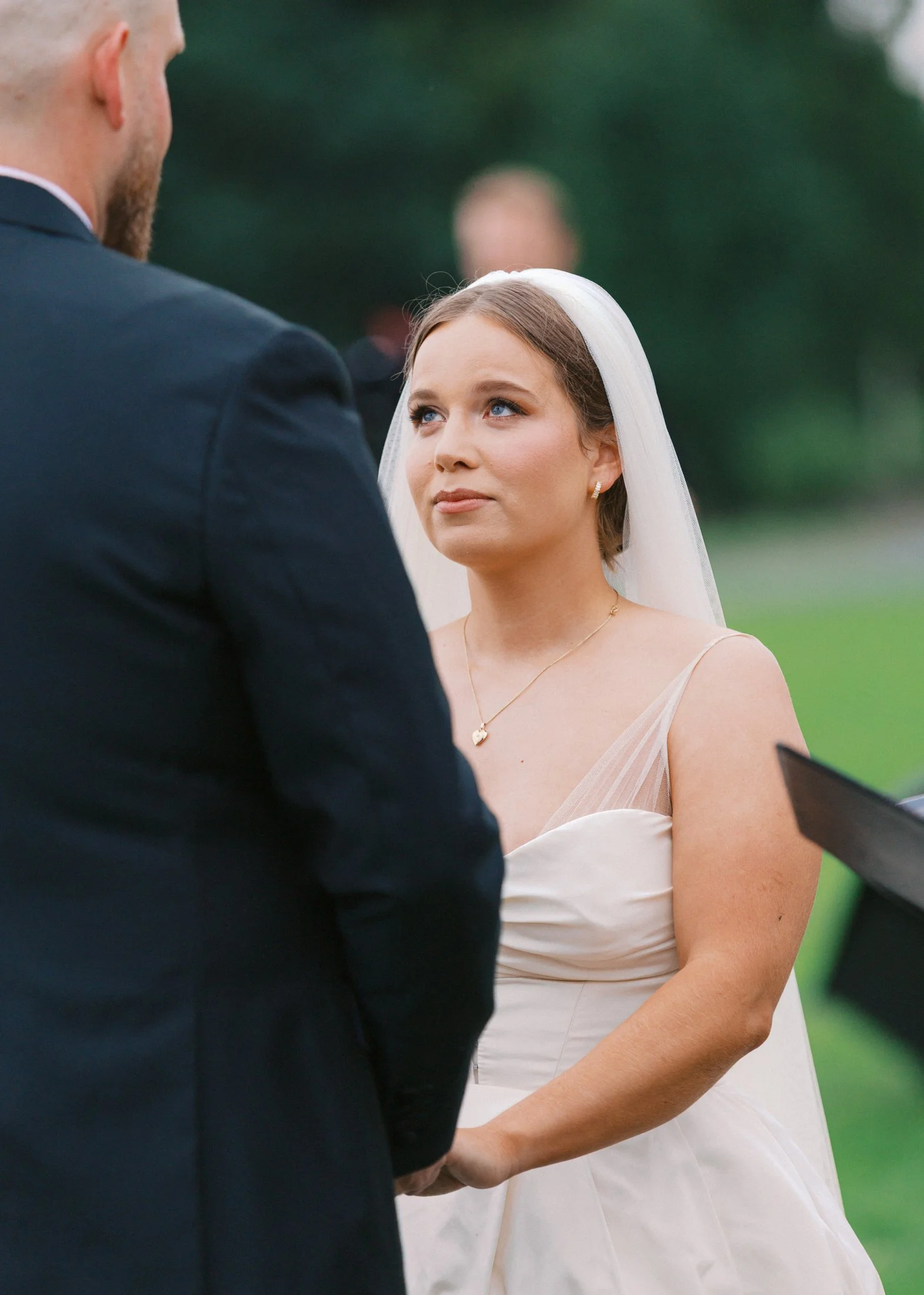 Ceremony at Fraser River Lodge with mountain views, floral ceremony design and candid guest reactions, documented in a natural editorial style with film + digital photography.