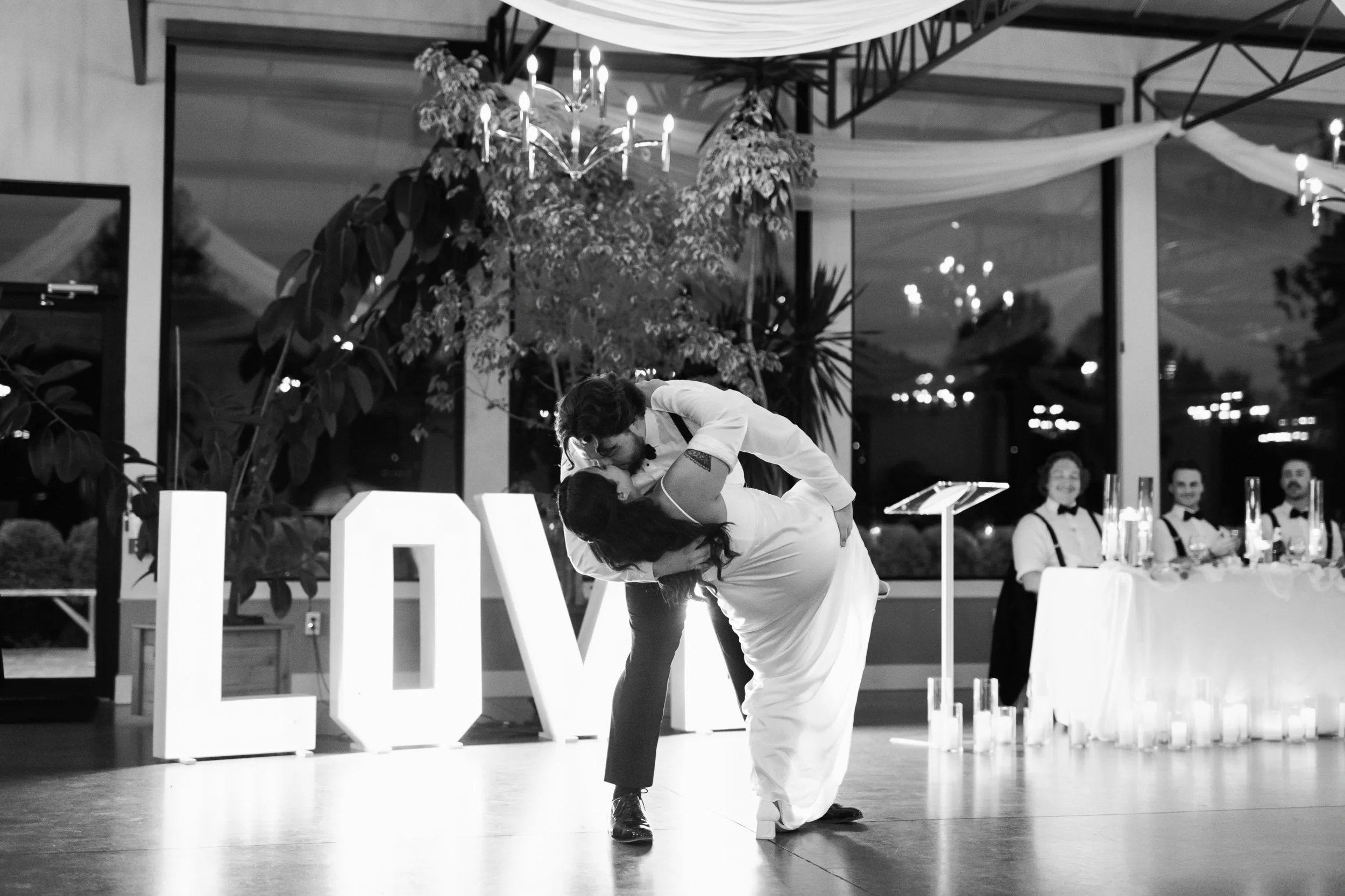 Emotional newlywed first dance captured in a modern, candlelit indoor reception space in Chilliwack BC.