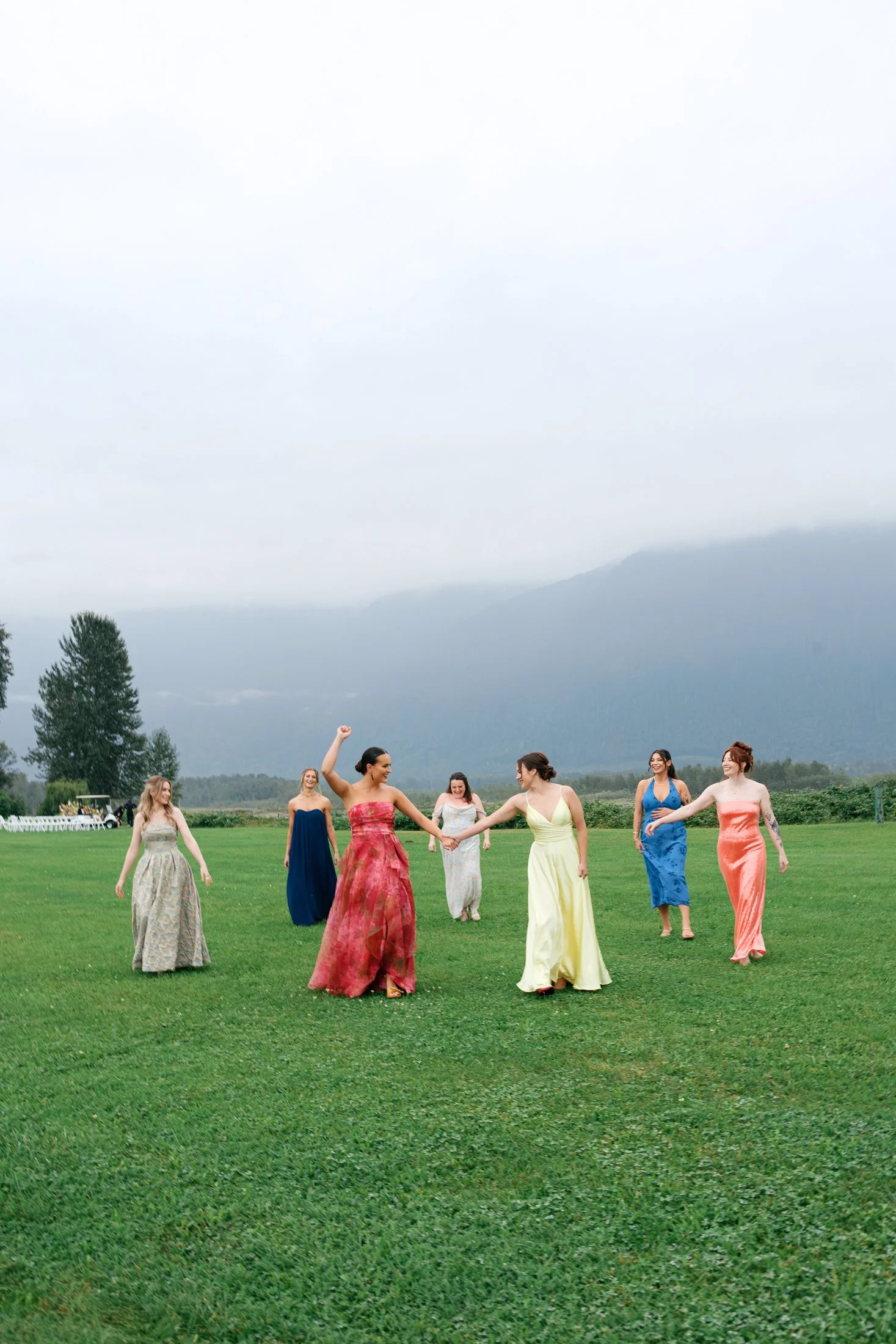 Bridal party group photos at Fraser River Lodge with mountain views and candid cocktail hour storytelling, photographed in a modern editorial style on film and digital.