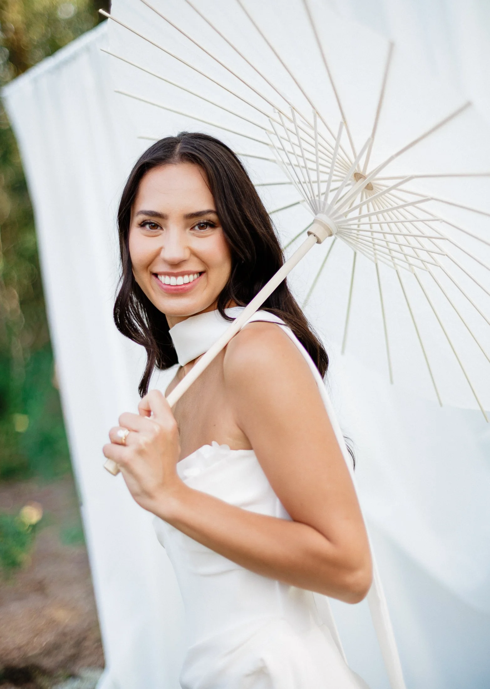 Editorial bridal portrait captured in front of soft ceremony drapery installation at Langley backyard wedding