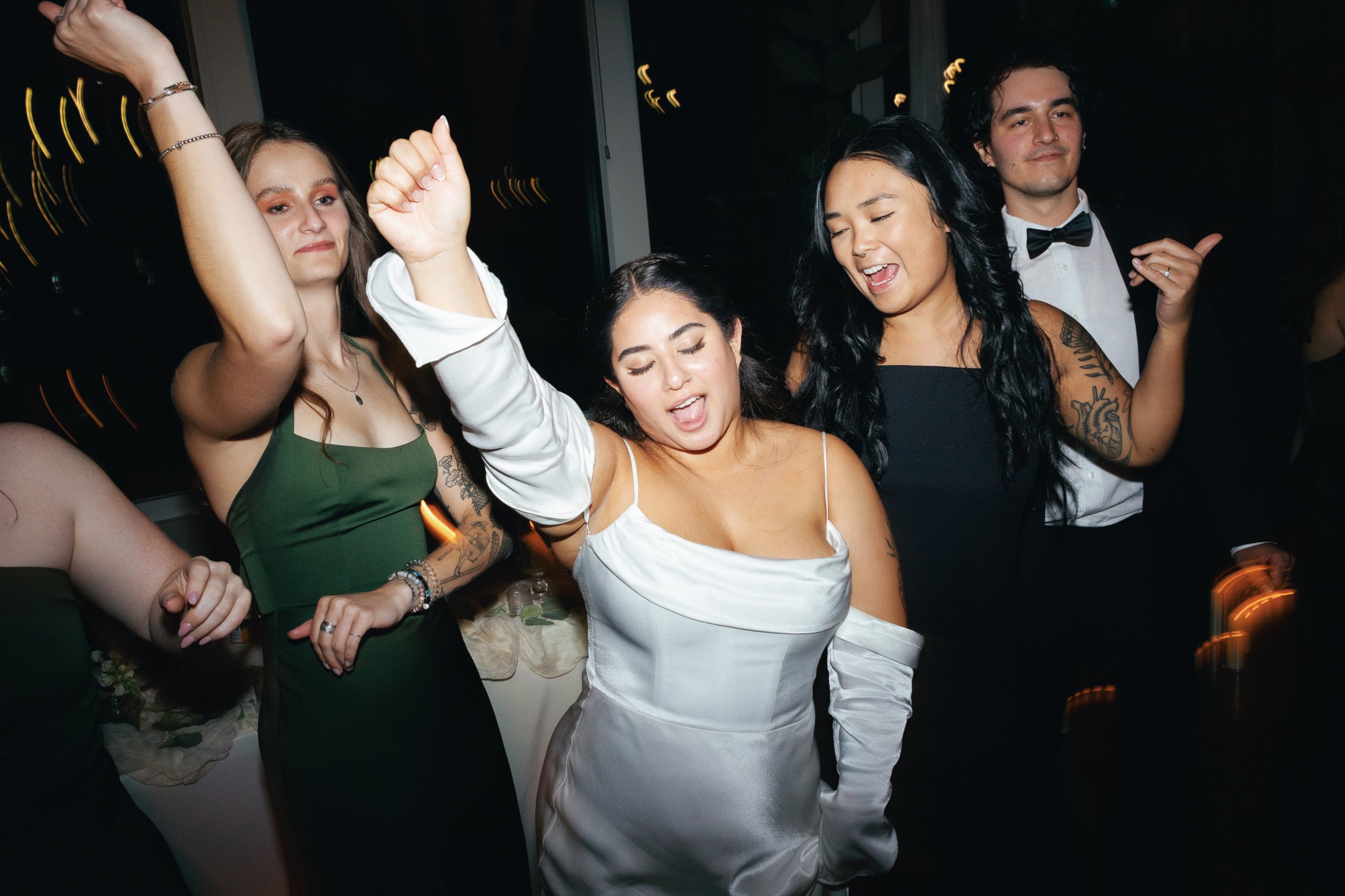 Candid reception party photography capturing laughter, movement, and lively celebration in Chilliwack BC.