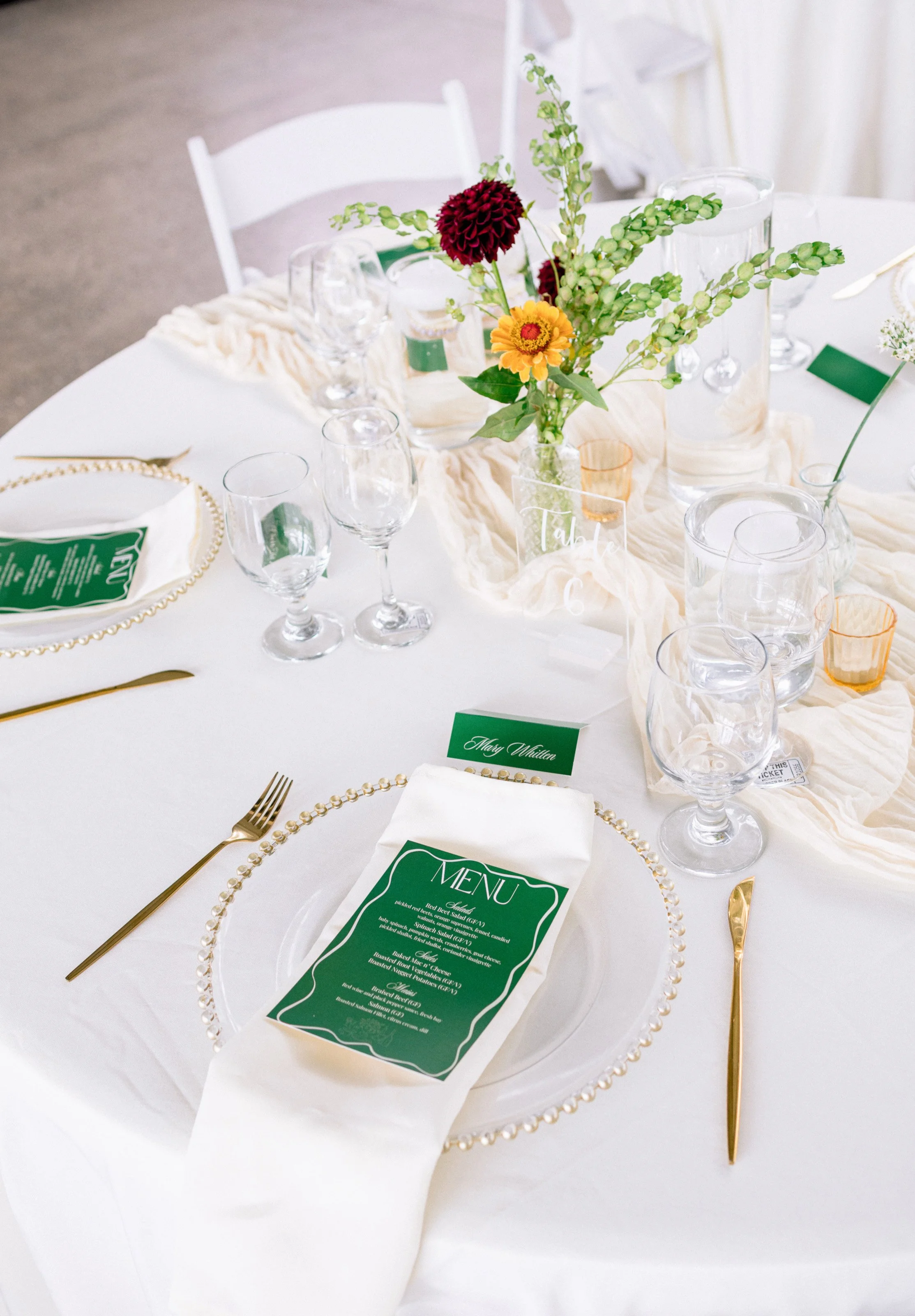 Modern romantic tablescape design with florals, taper candles, and layered textures at a countryside wedding venue in Chilliwack, photographed on film and digital.