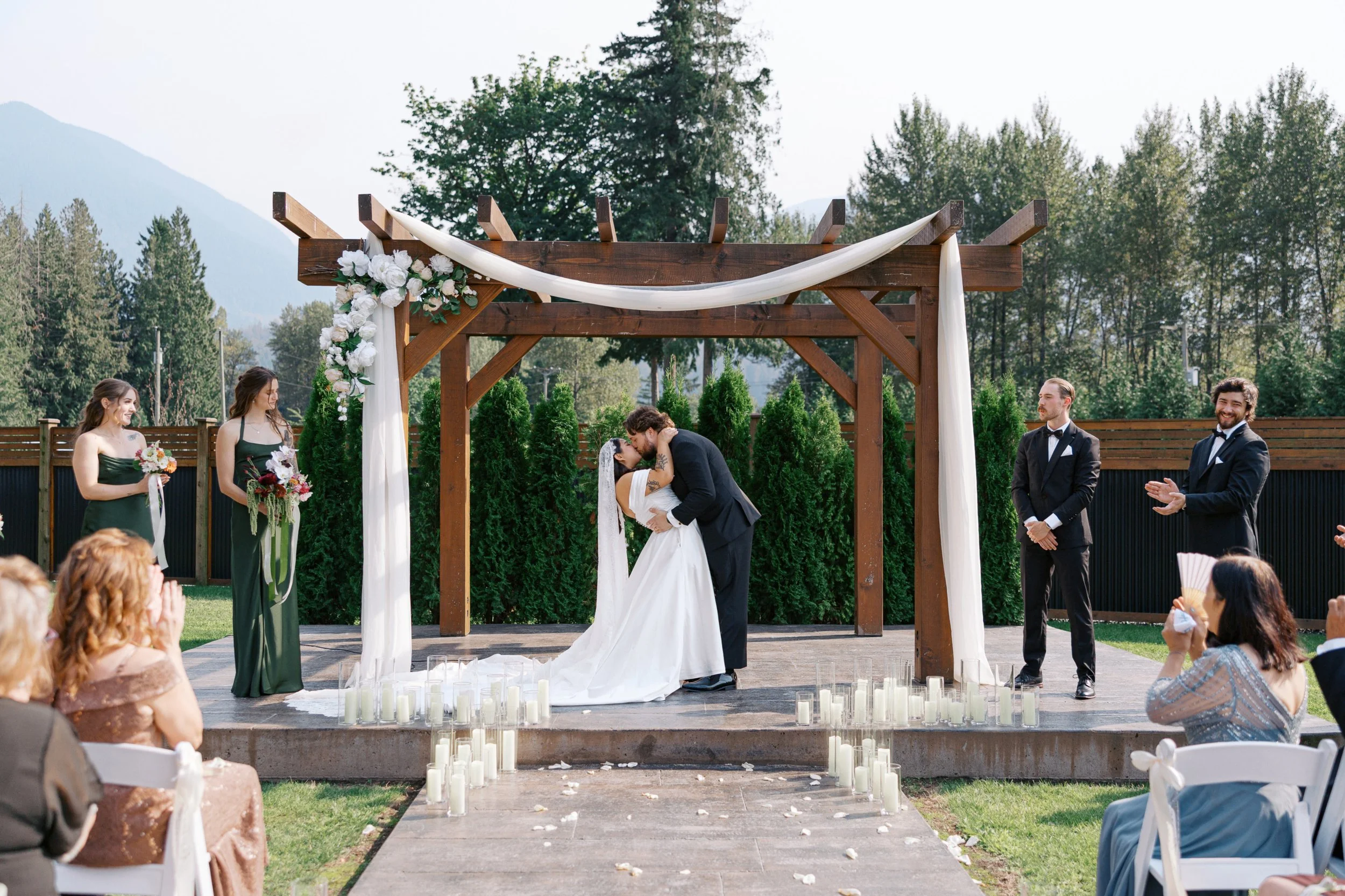 Modern romantic wedding ceremony with soft natural light, floral details, and intimate moments during the exchange of vows.