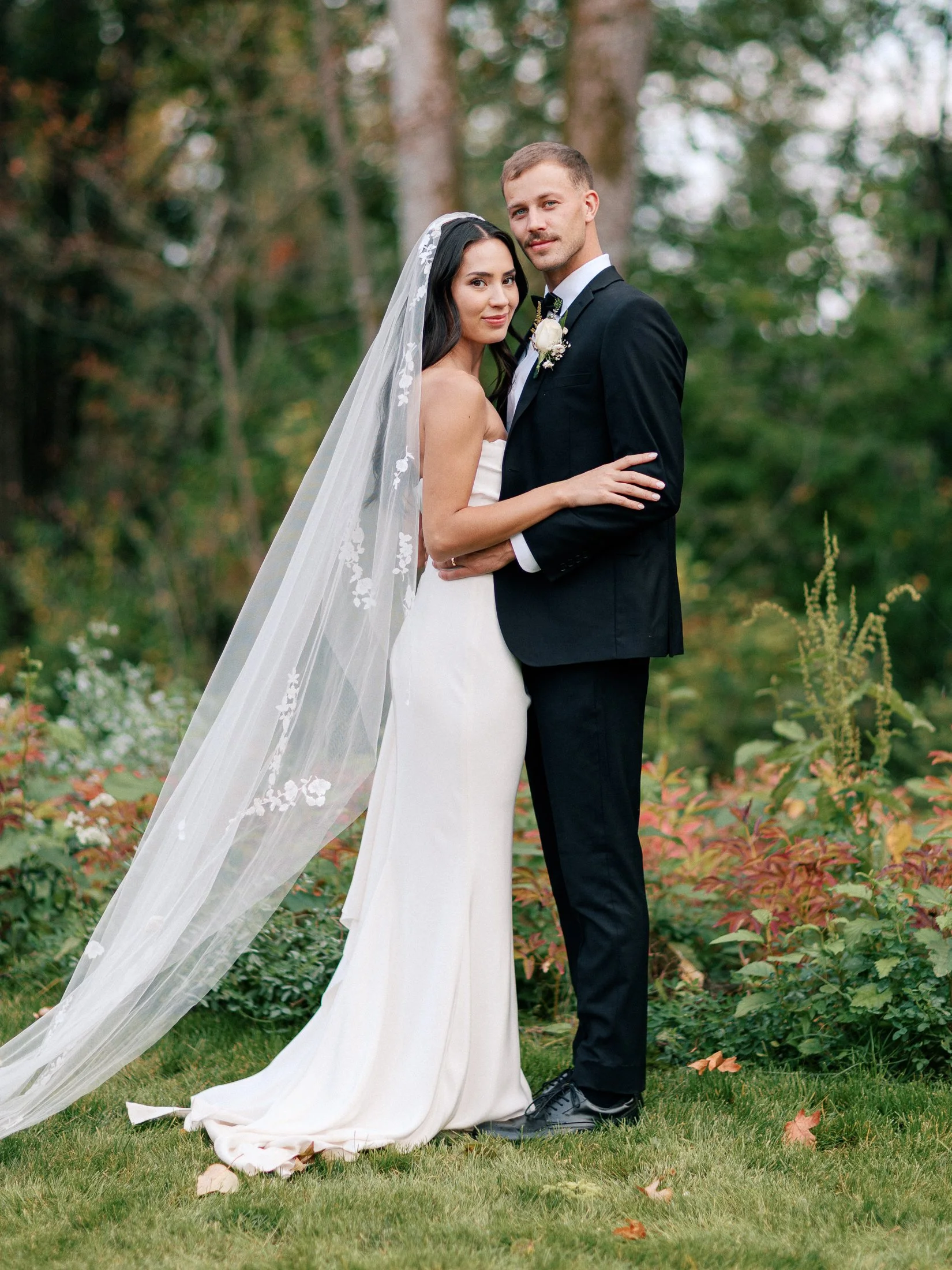 Bride and groom portrait at modern luxury backyard wedding in Langley BC surrounded by garden greenery