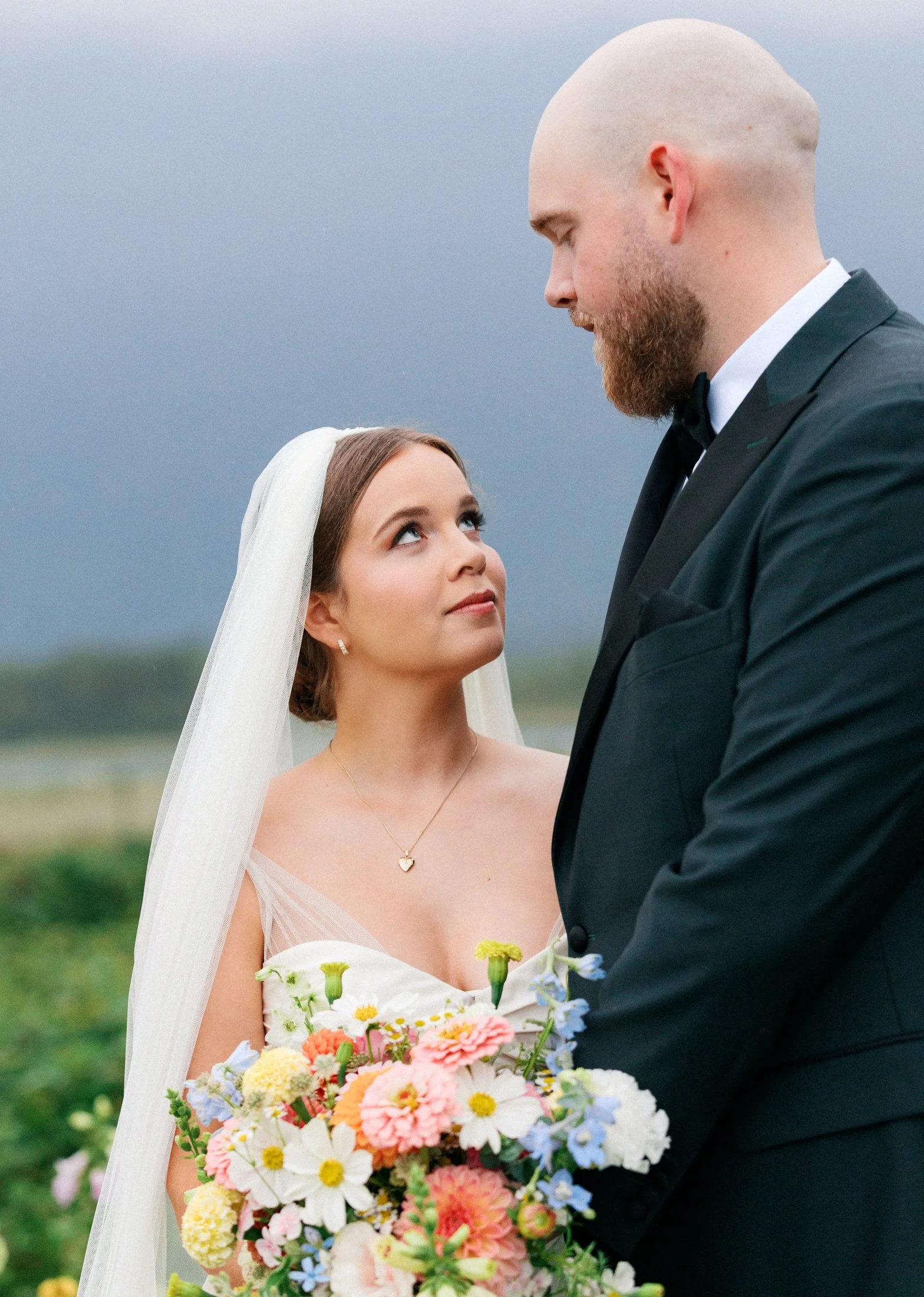 Fraser River Lodge wedding portrait session outdoors with ceremony florals and mountain views photographed in an editorial documentary approach using film and digital.