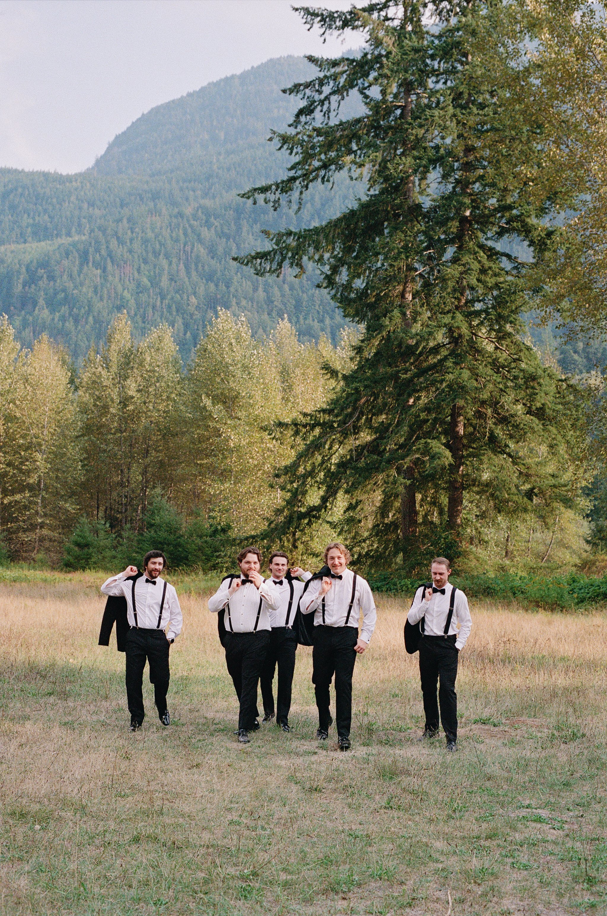 Romantic and candid wedding party photos captured outdoors in Chilliwack, highlighting natural movement and genuine connection.