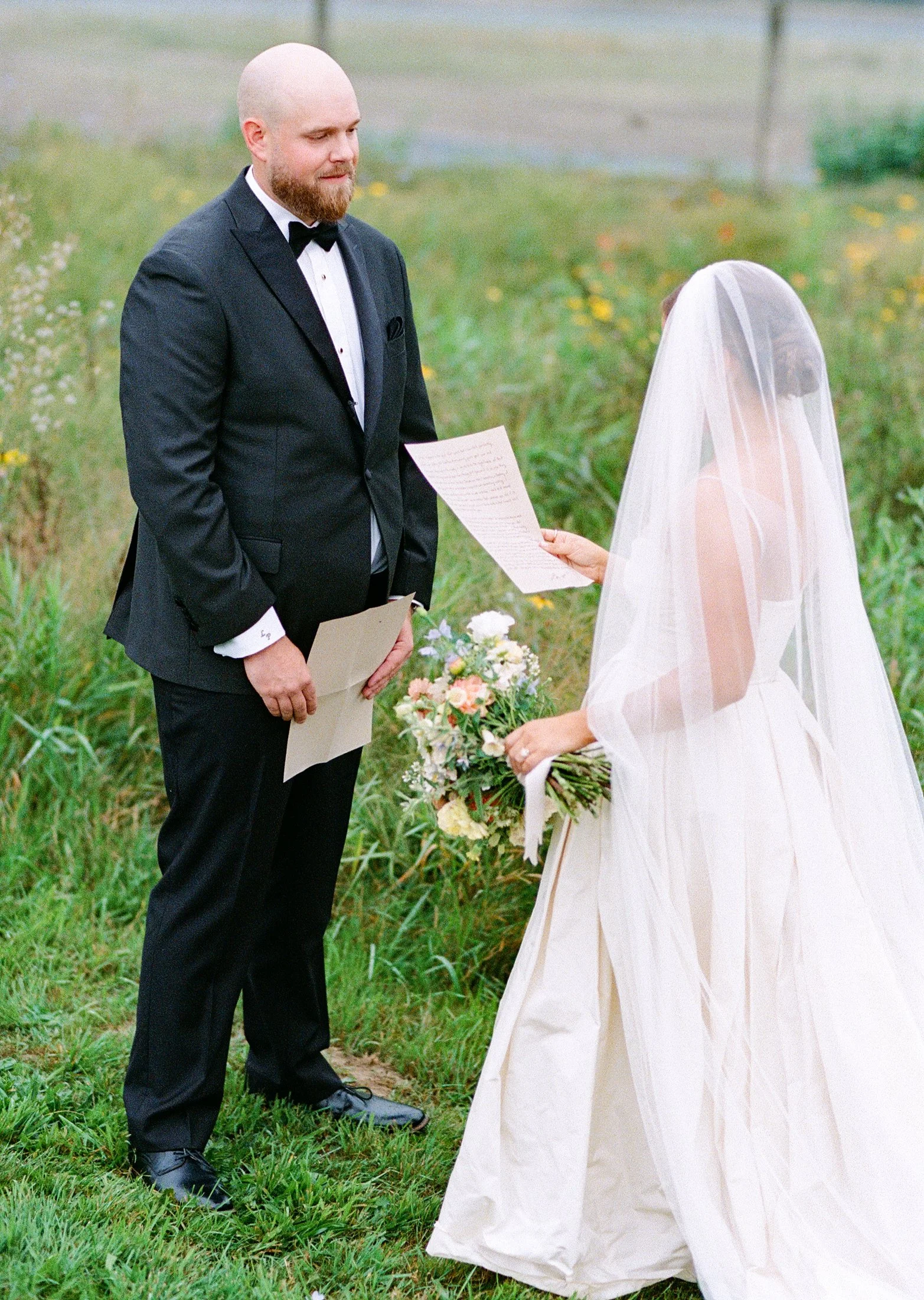 Private vow exchange at Fraser River Lodge in the mountains — intimate couple moment photographed in a cinematic editorial style using hybrid film and digital wedding photography.