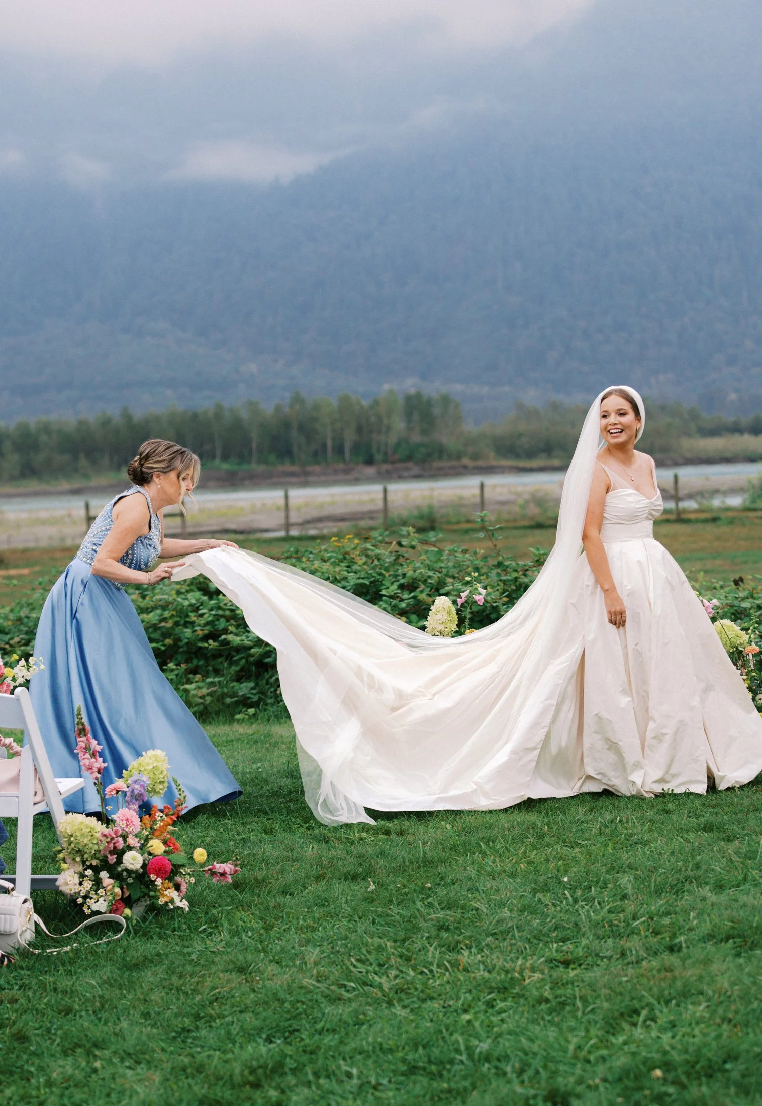 Outdoor ceremony at Fraser River Lodge in the Fraser Valley with ceremony decor, guests and authentic candid reactions, photographed by a Vancouver wedding photographer using film + digital.