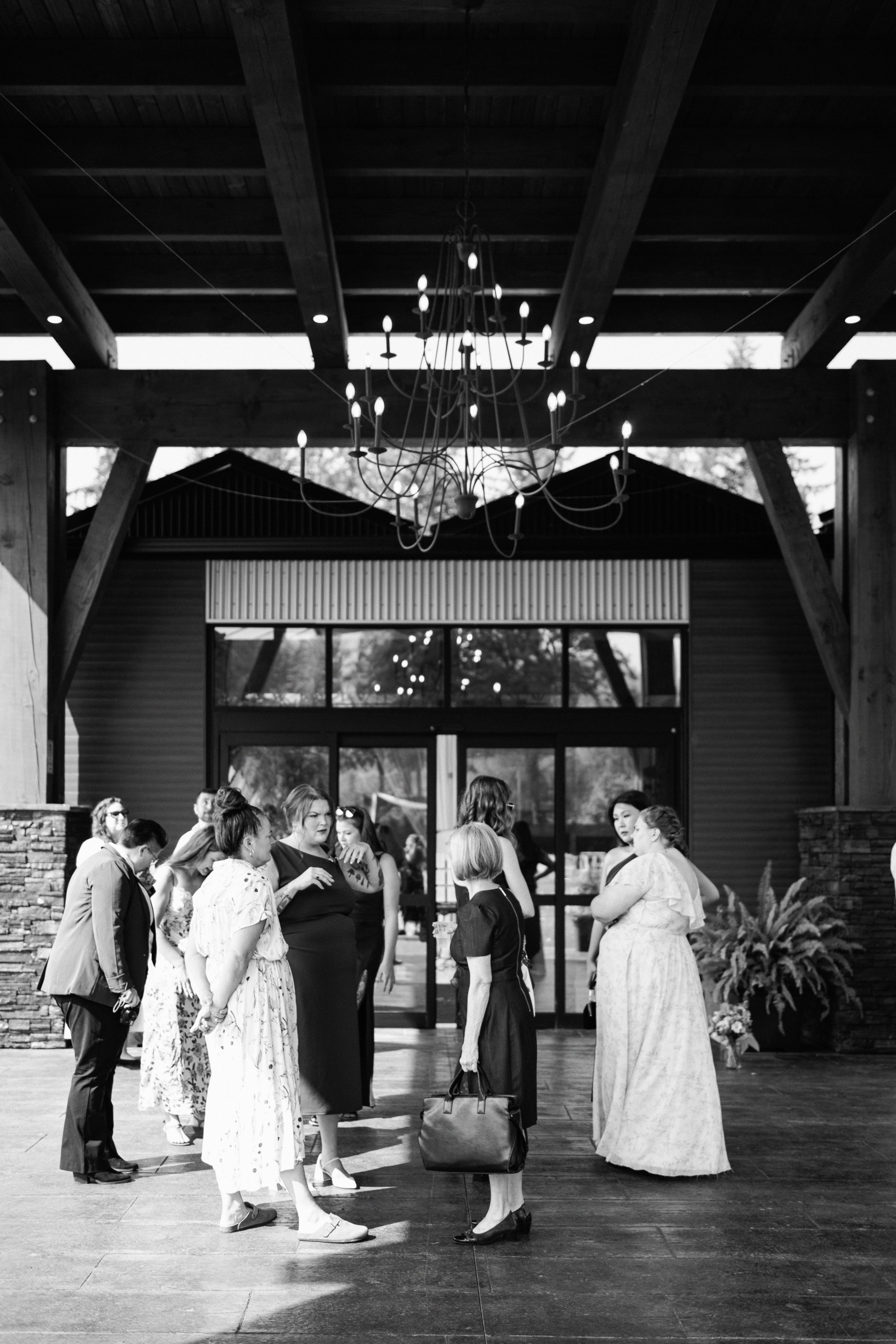 Scenic exterior of a Fraser Valley wedding venue featuring open landscapes, elegant ceremony seating, and guests gathering before the ceremony.