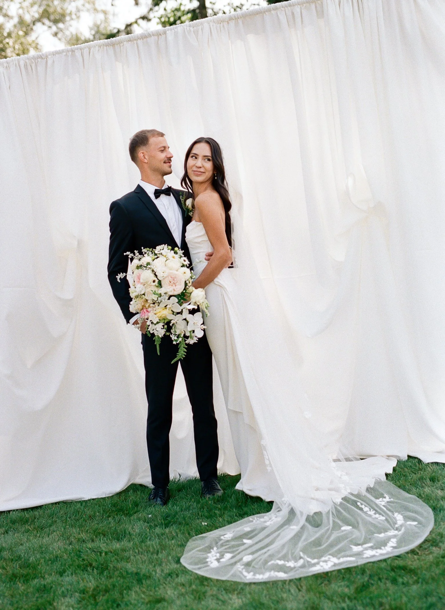 Modern luxury backyard wedding in Langley BC featuring bride and groom portraits captured on film and digital photography in an elegant garden setting