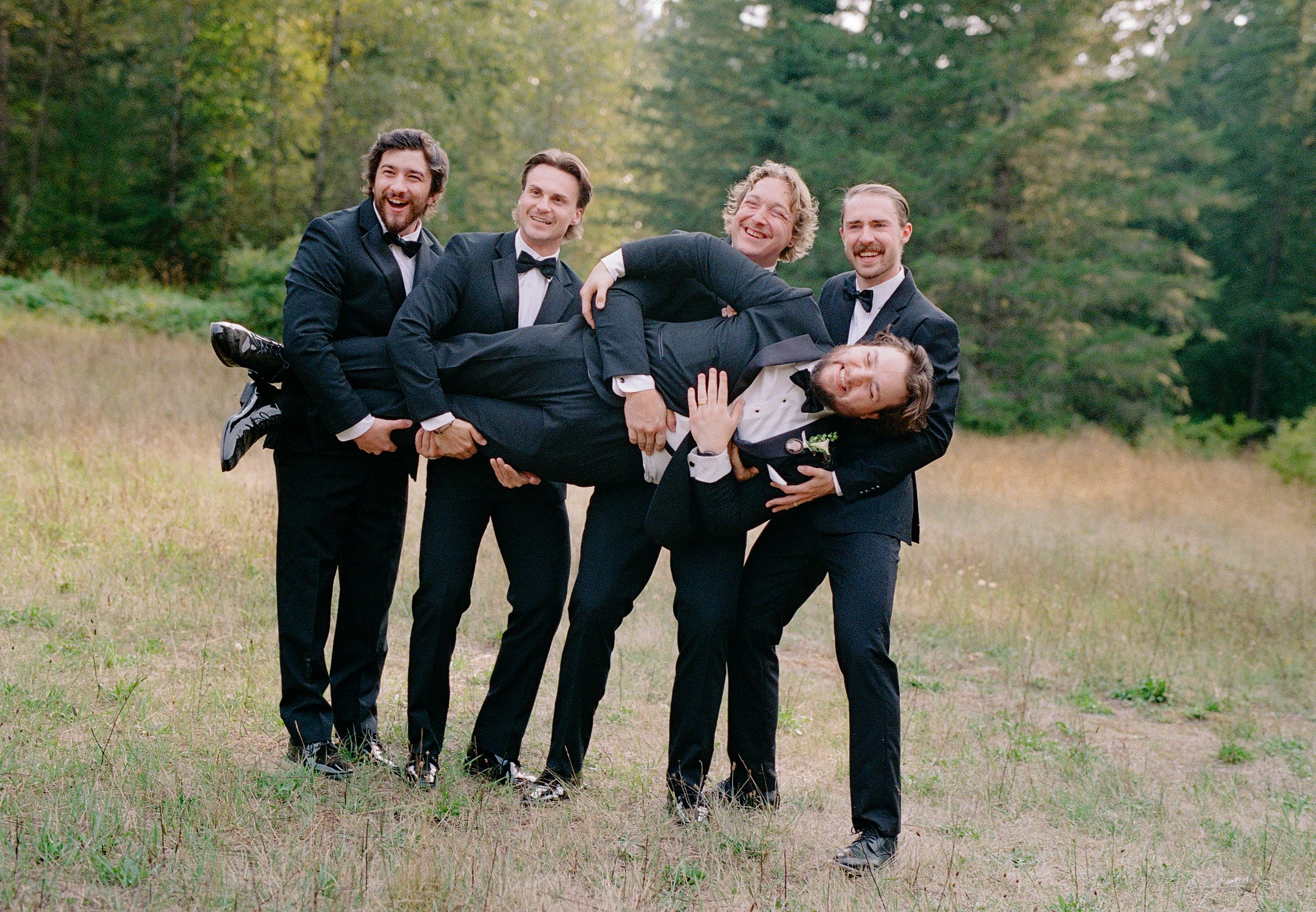 Bride and groom with their wedding party in modern romantic portraits at Bridle Woods Event Centre.