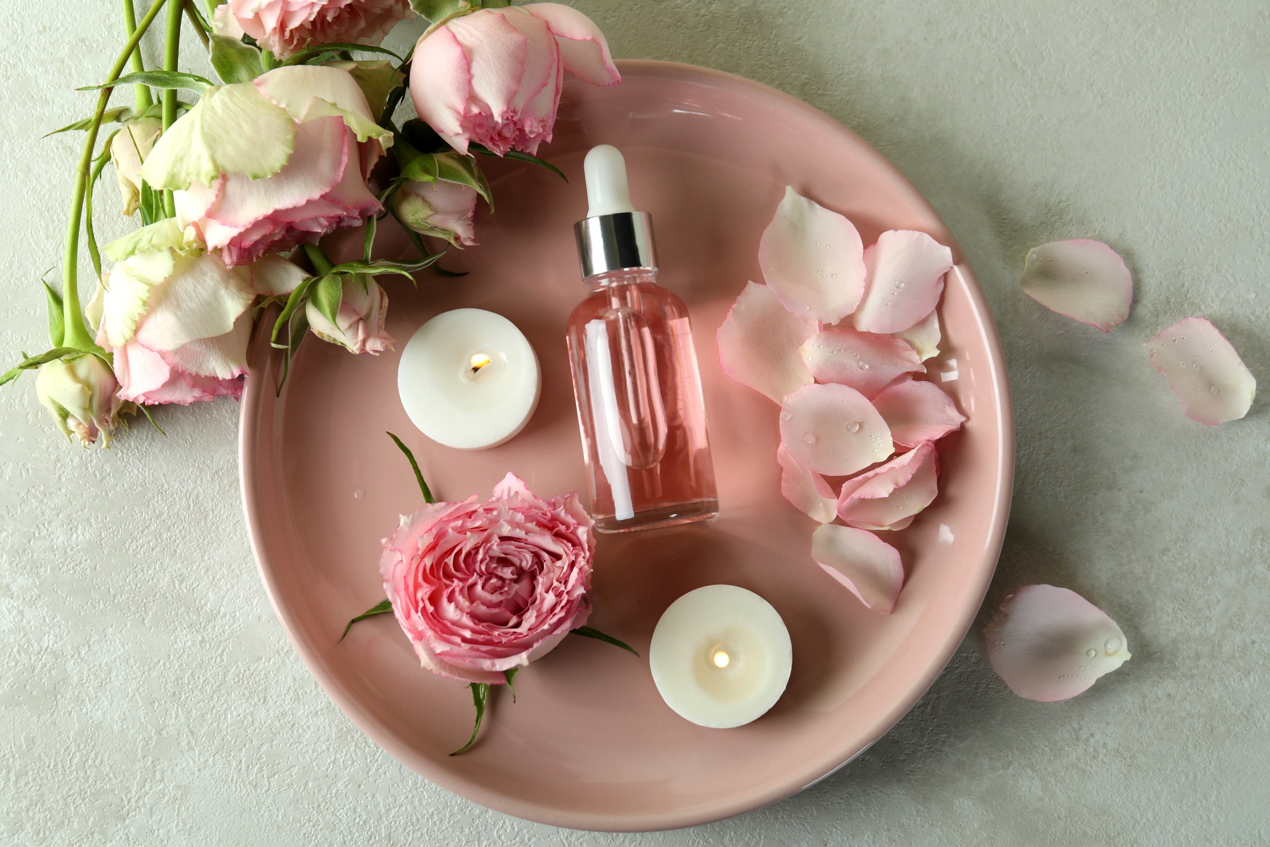 skin-care-concept-with-essential-rose-oil-on-white-2023-11-27-05-36-36-utc.jpg