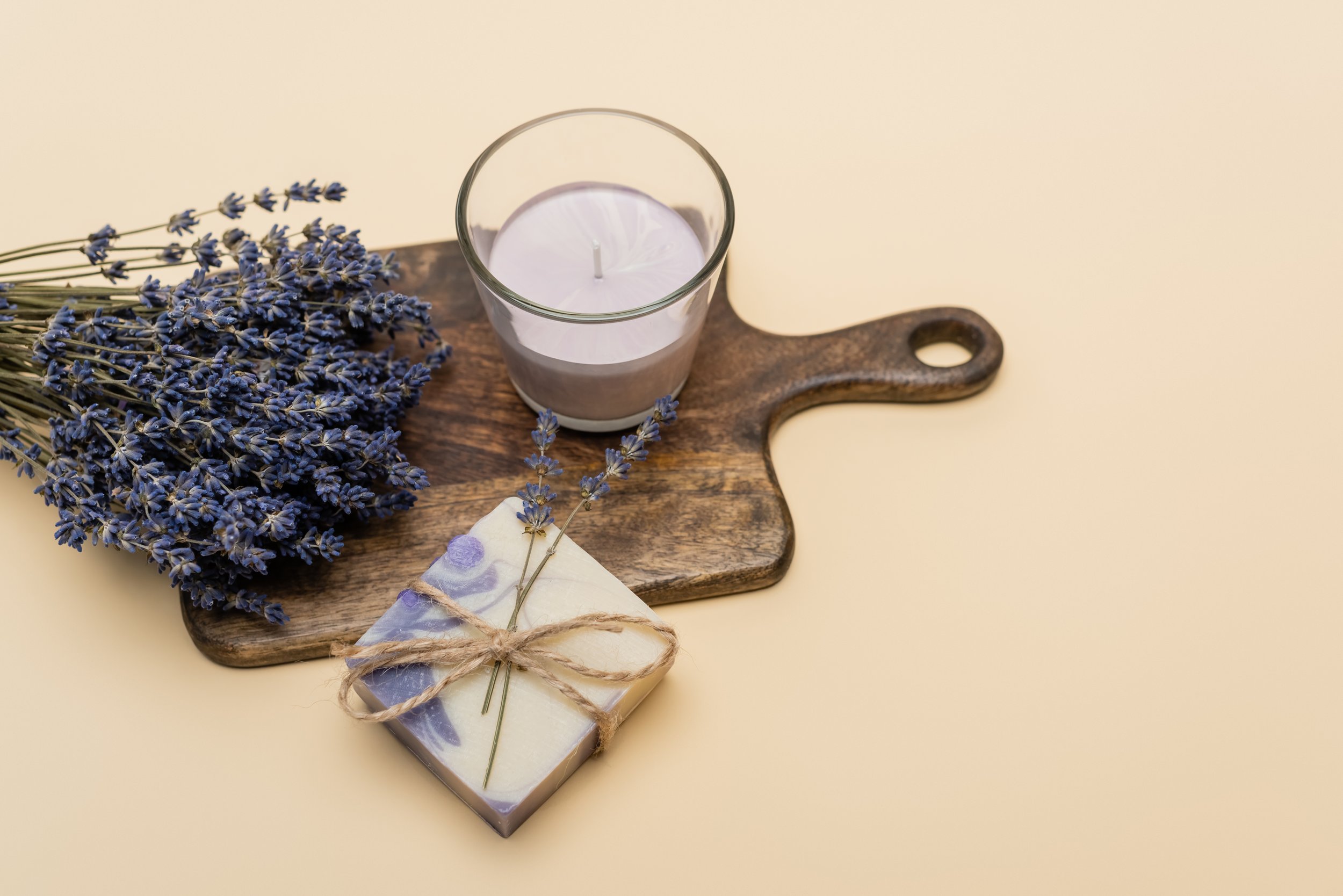 top-view-of-lavender-near-handmade-soap-and-candle-2023-11-27-05-01-41-utc.jpg