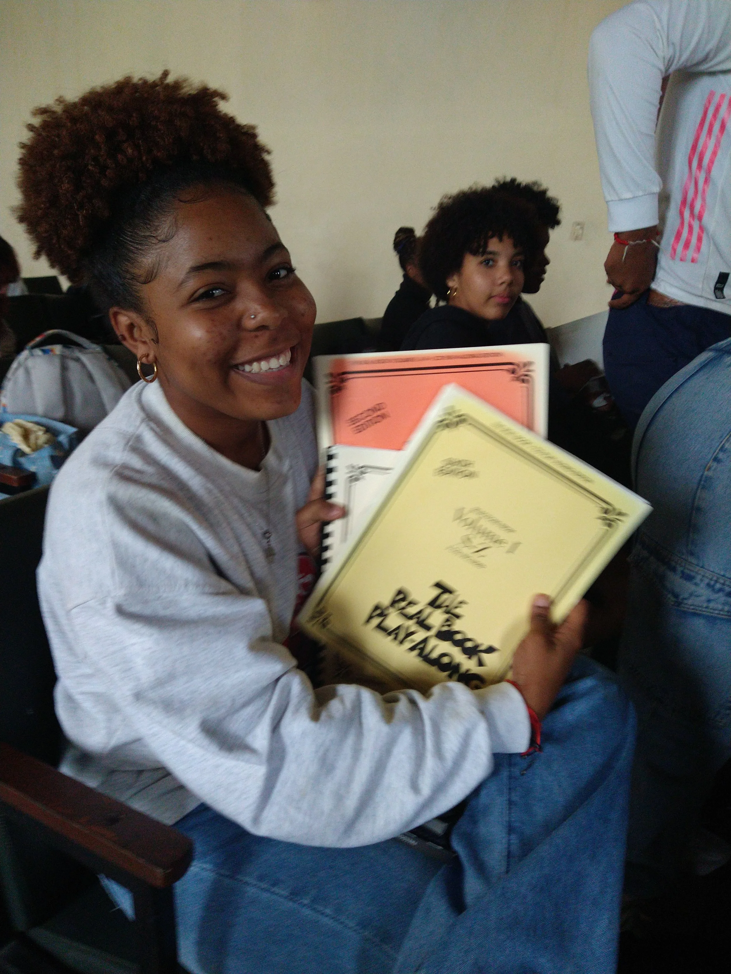 Student with books Jazz Week.jpg