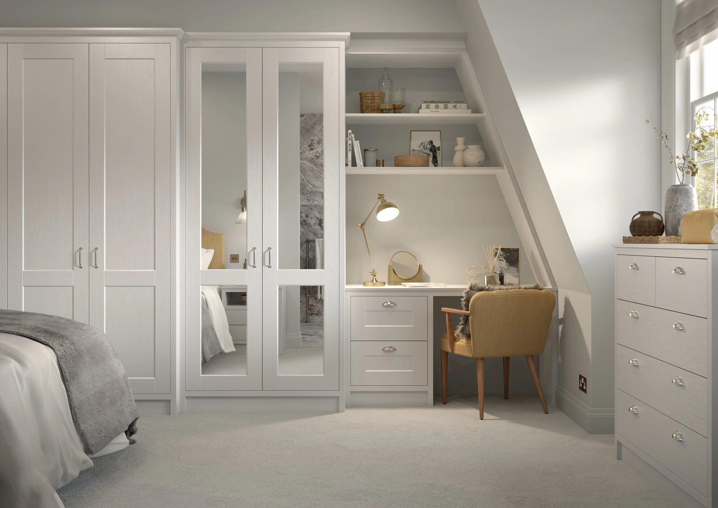 Close up of bespoke bedroom furniture comprising of desk area and mirrored wardrobe doors