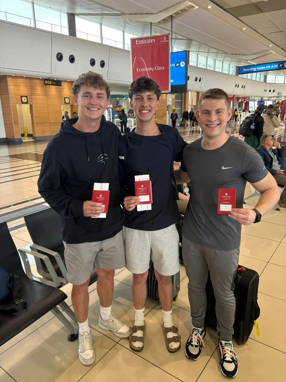 Christo,Andre and Drean with our workaway passports at airport.jpg