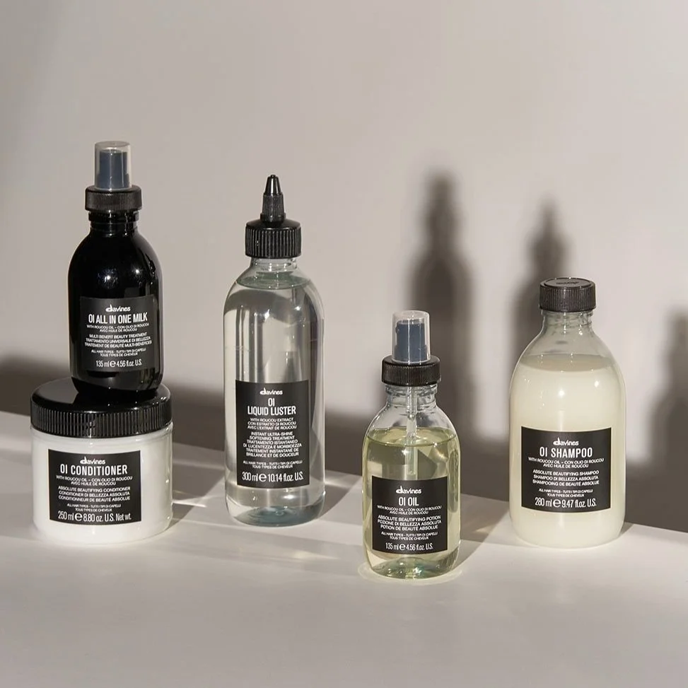 Davines hair care products are displayed on a flat surface.