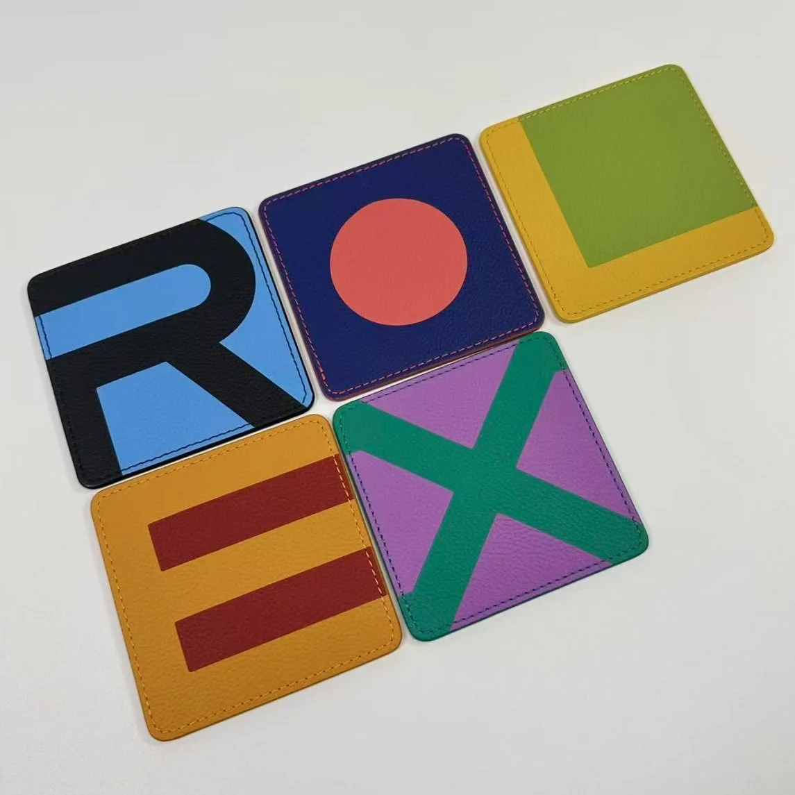 Rolex Oyster 100th Anniversary Grained Leather Geometric Coaster Set