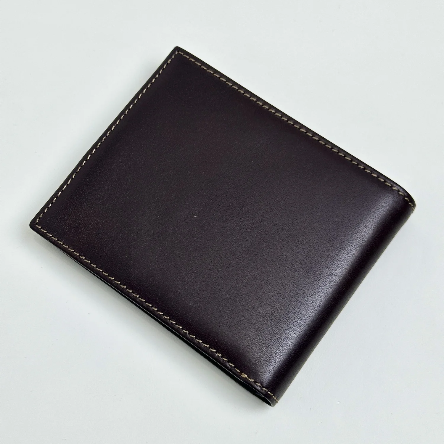 Patek Philippe Brown Leather Bifold Wallet with Embossed Logo