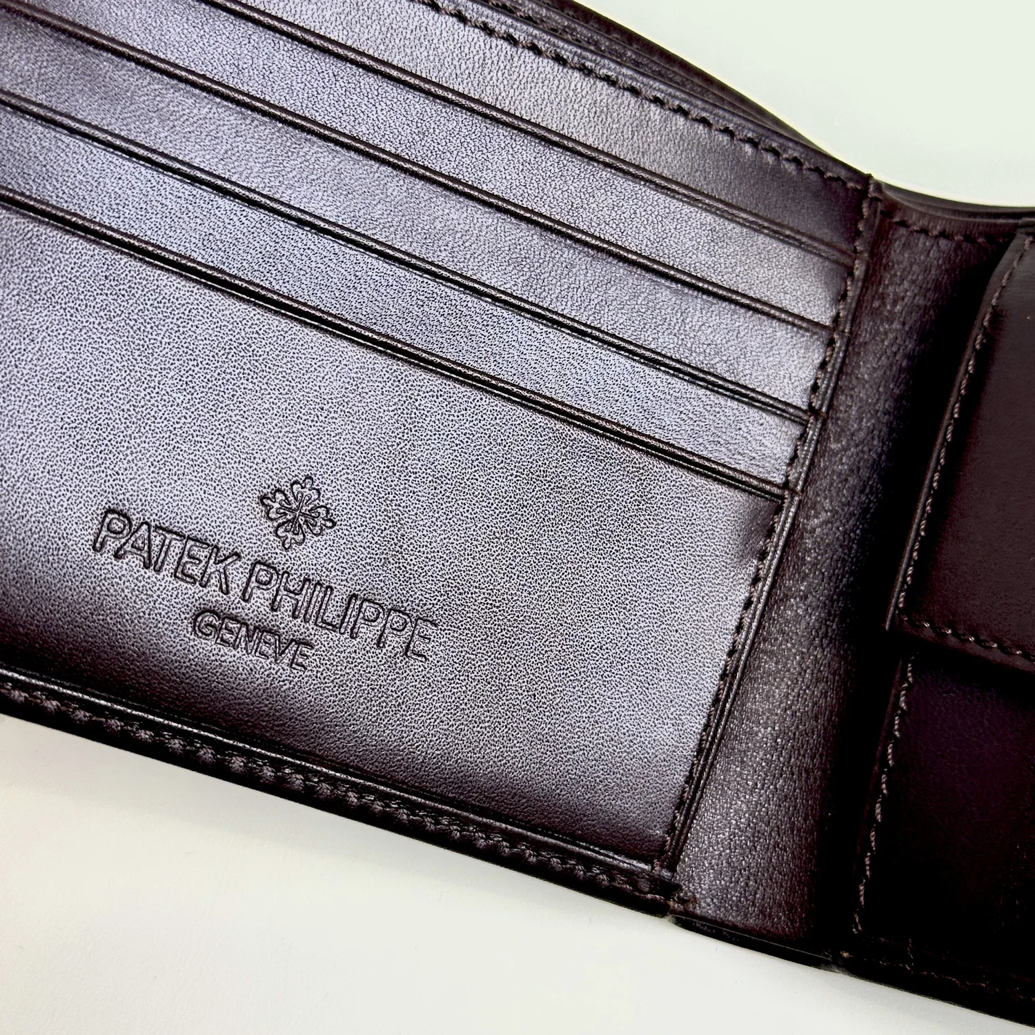 Patek Philippe Brown Leather Bifold Wallet with Embossed Logo