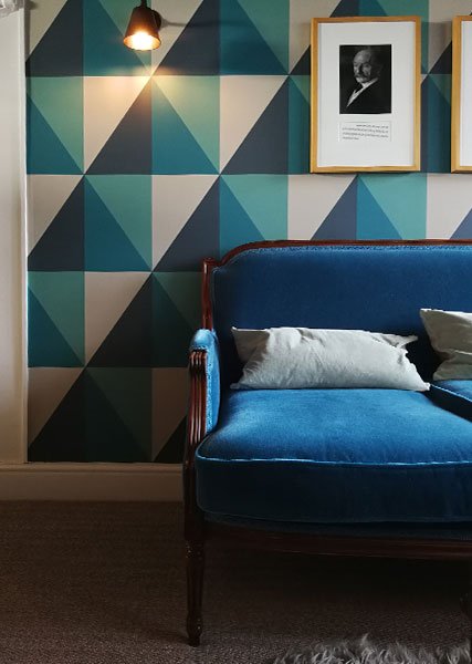 geometric-wallpaper-mural-teal-sofa