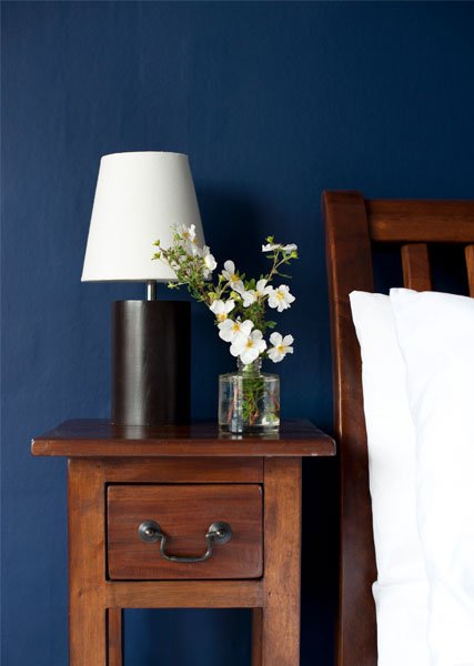 muted-blue-painted-wall-bedside-table-bedroom