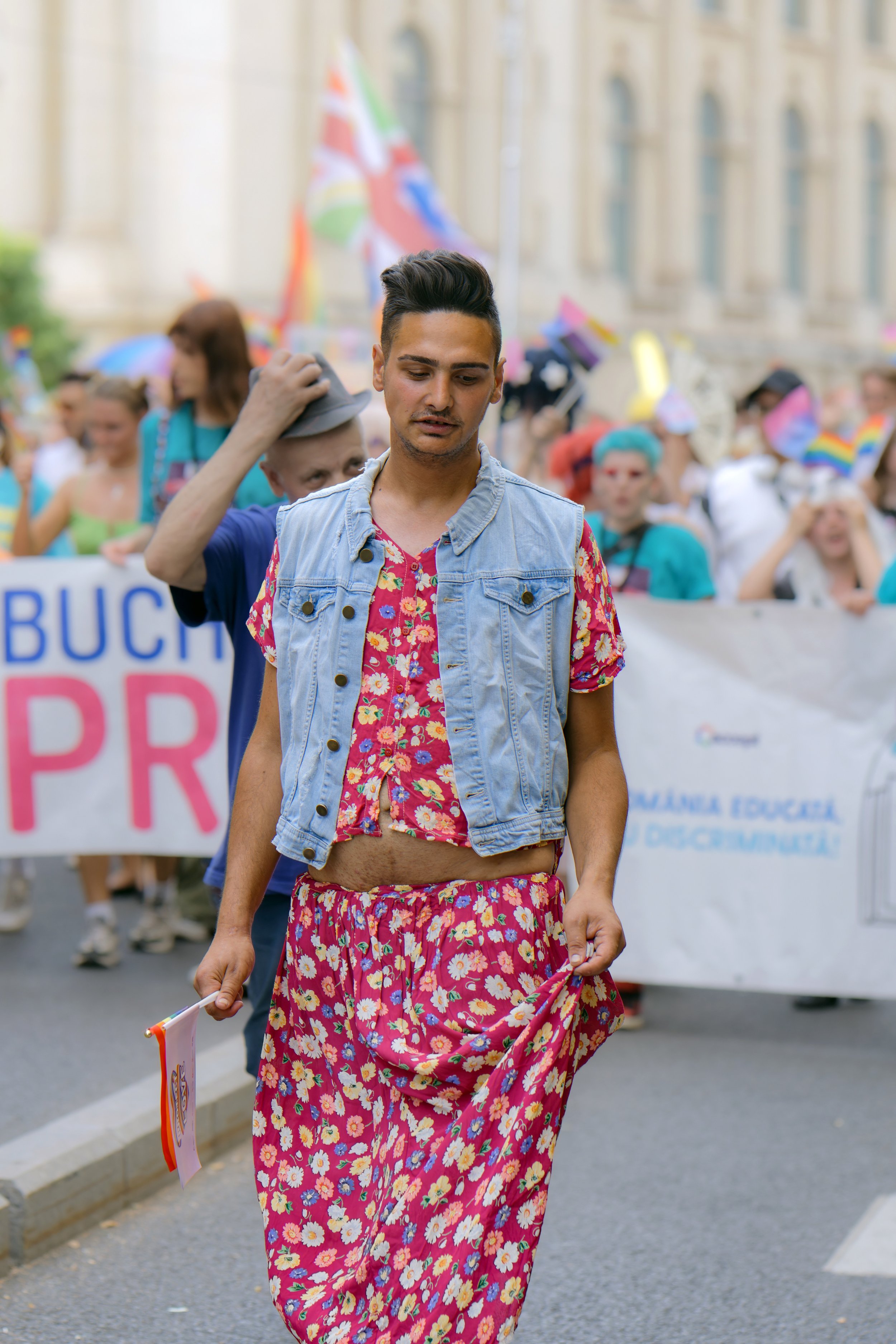 Transgender person participating in a Pride parade, illustrating identity, visibility, and experiences of minority stress relevant to EMDR Therapy