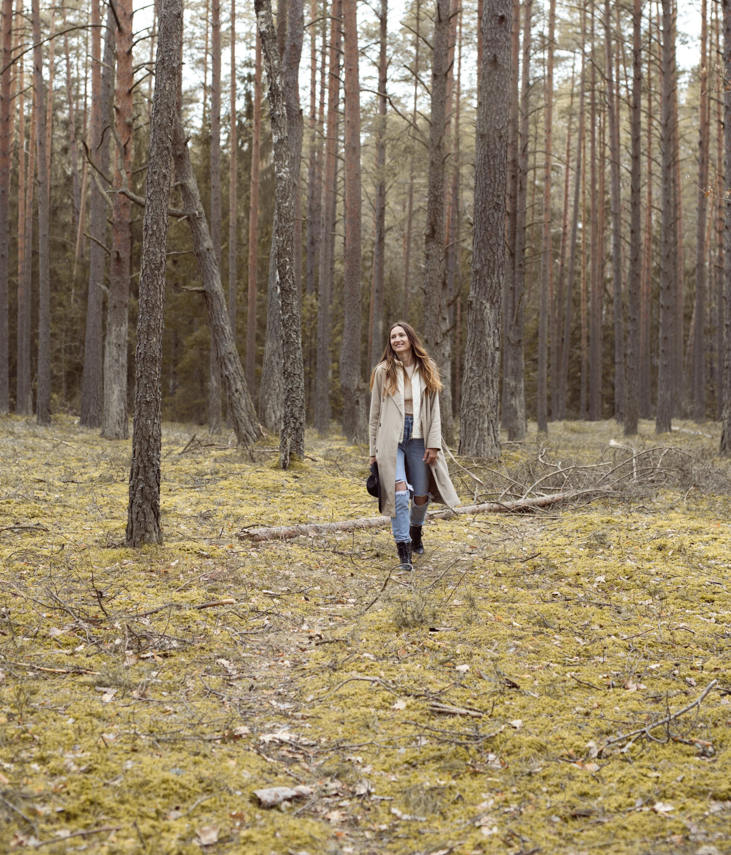 Woman walking through a peaceful forest, illustrating nature therapy, ecotherapy, and IFS therapy for depression