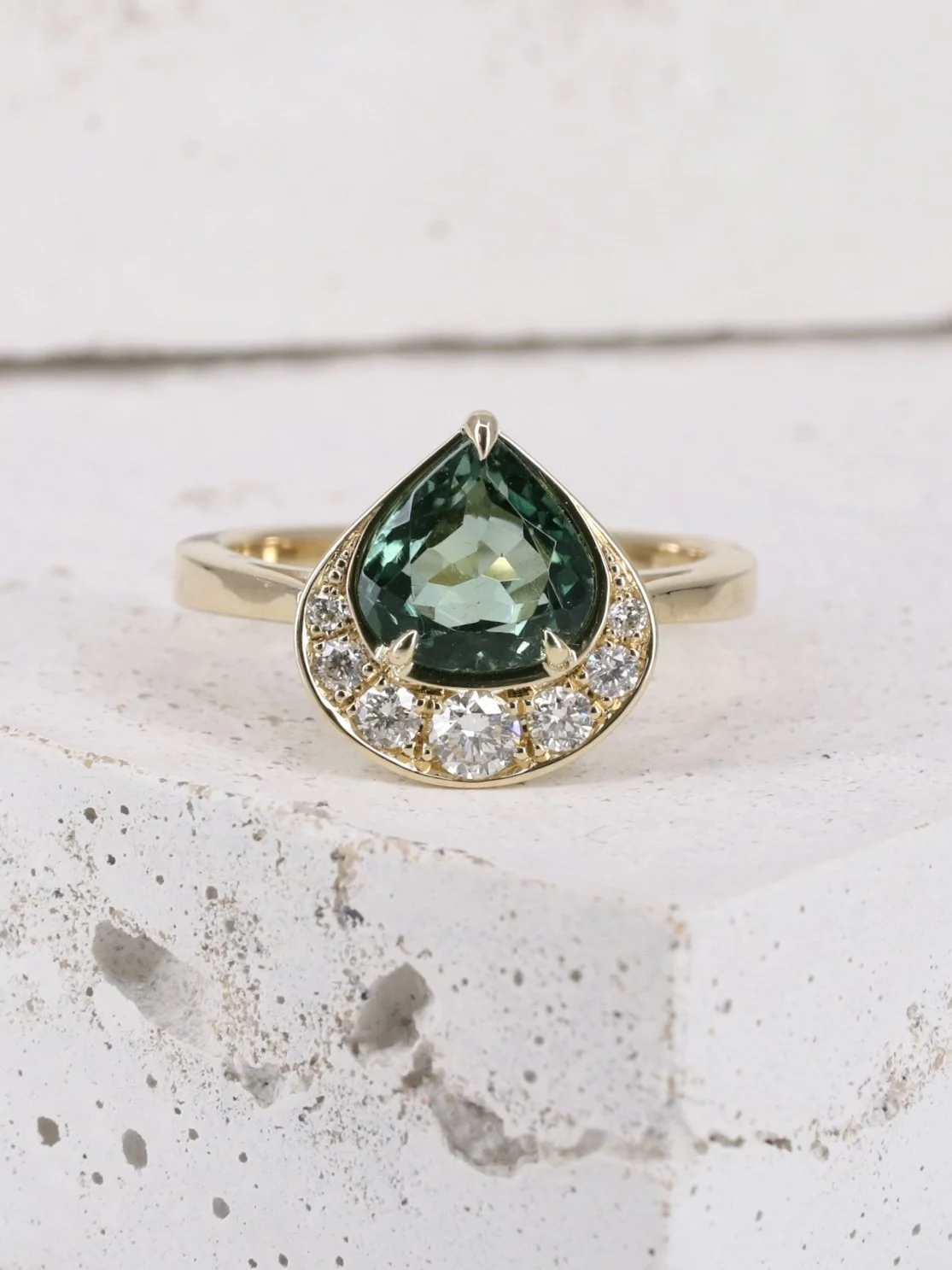 Sea green pear tourmaline and white diamond crescent halo ring 6.jpg