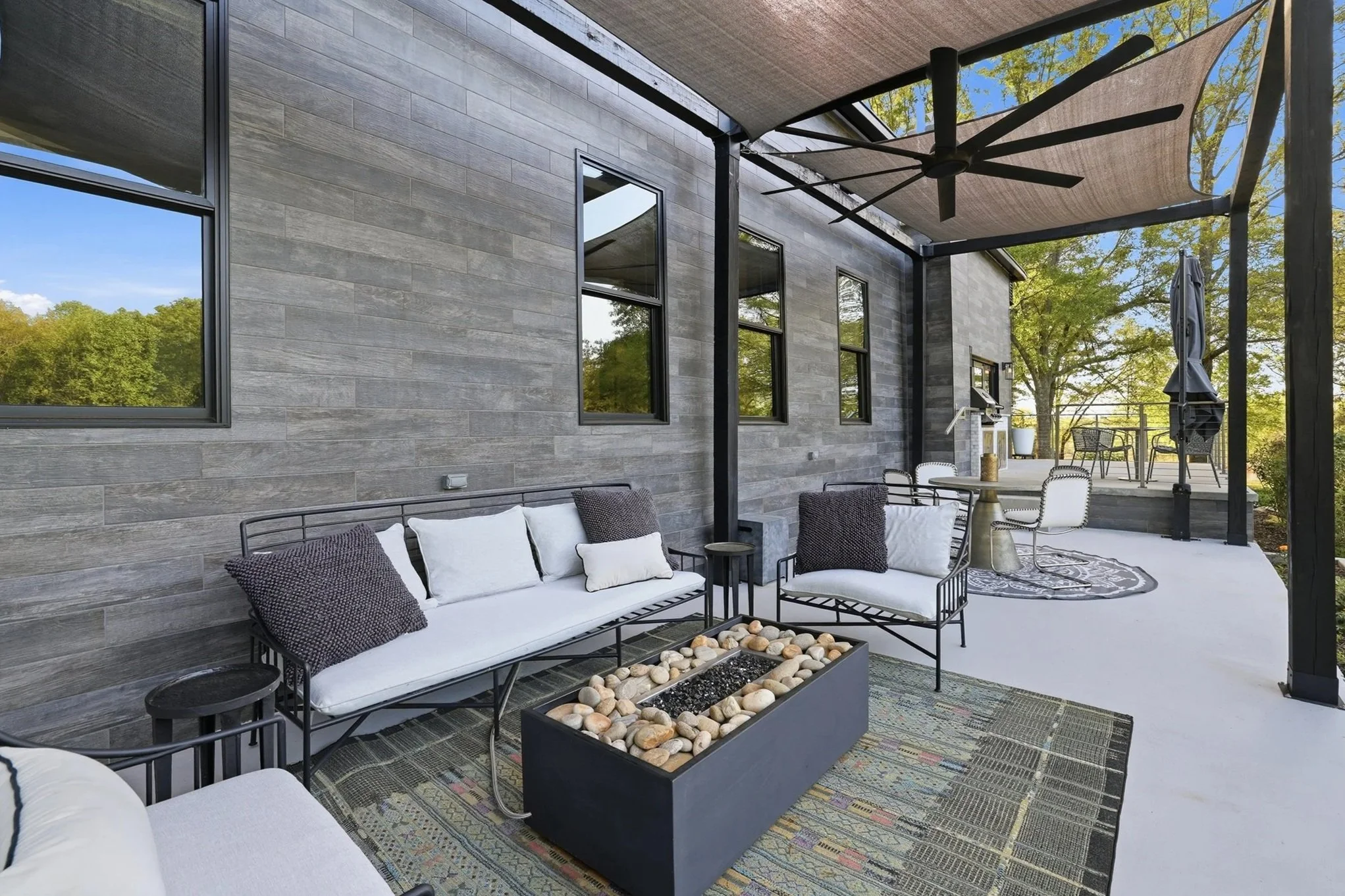 Cozy lower back patio living room set with gas fire pit