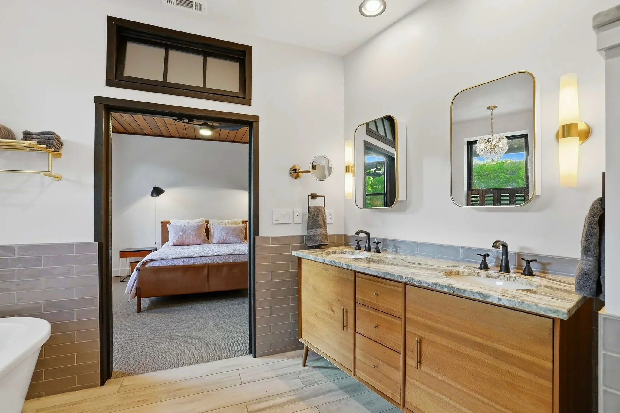 Custom transom windows throughout add a subtle vintage touch and juxtapose the modern