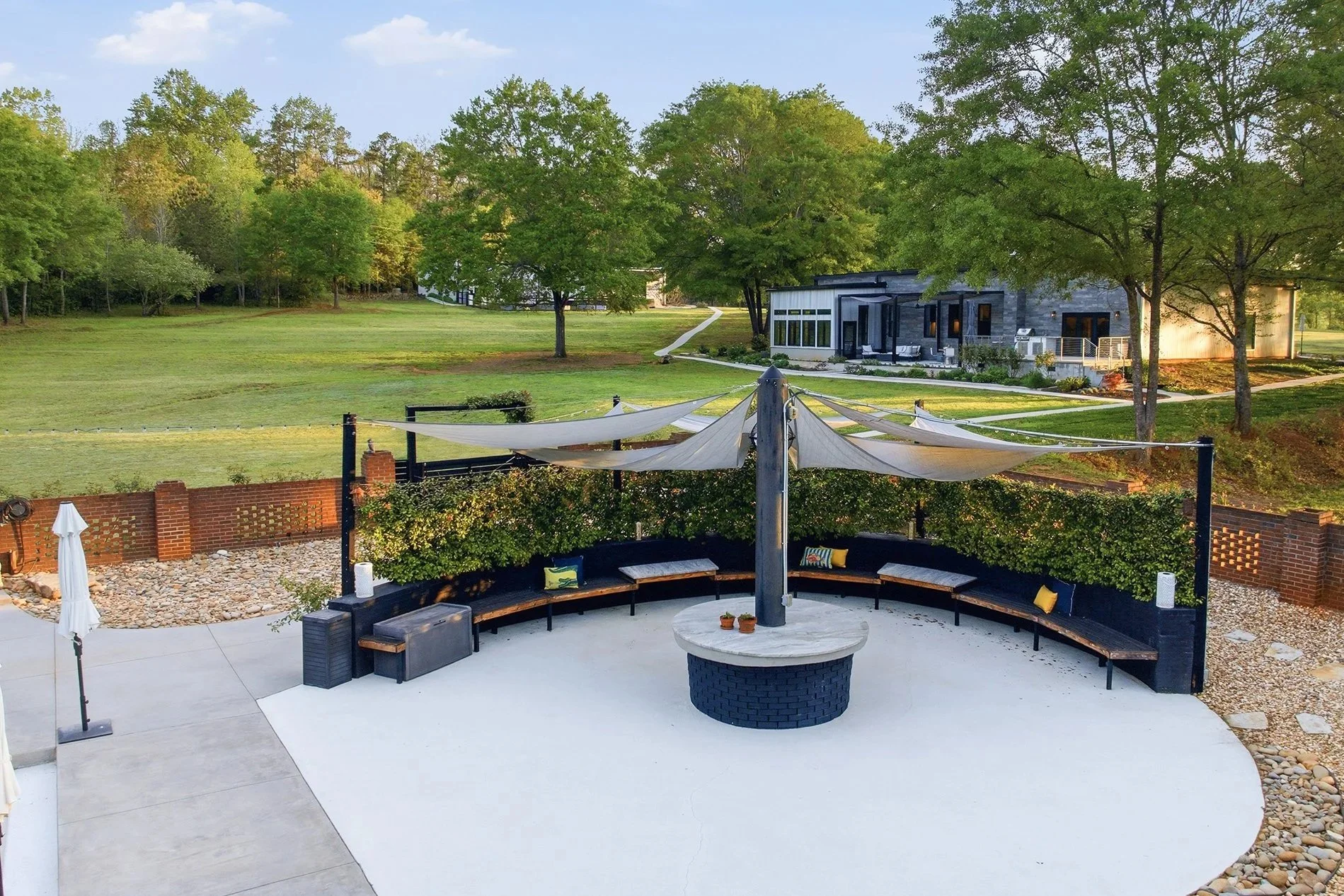 A spacious 35-foot circular seating area, shaded with graceful sail panels, offers the perfect retreat