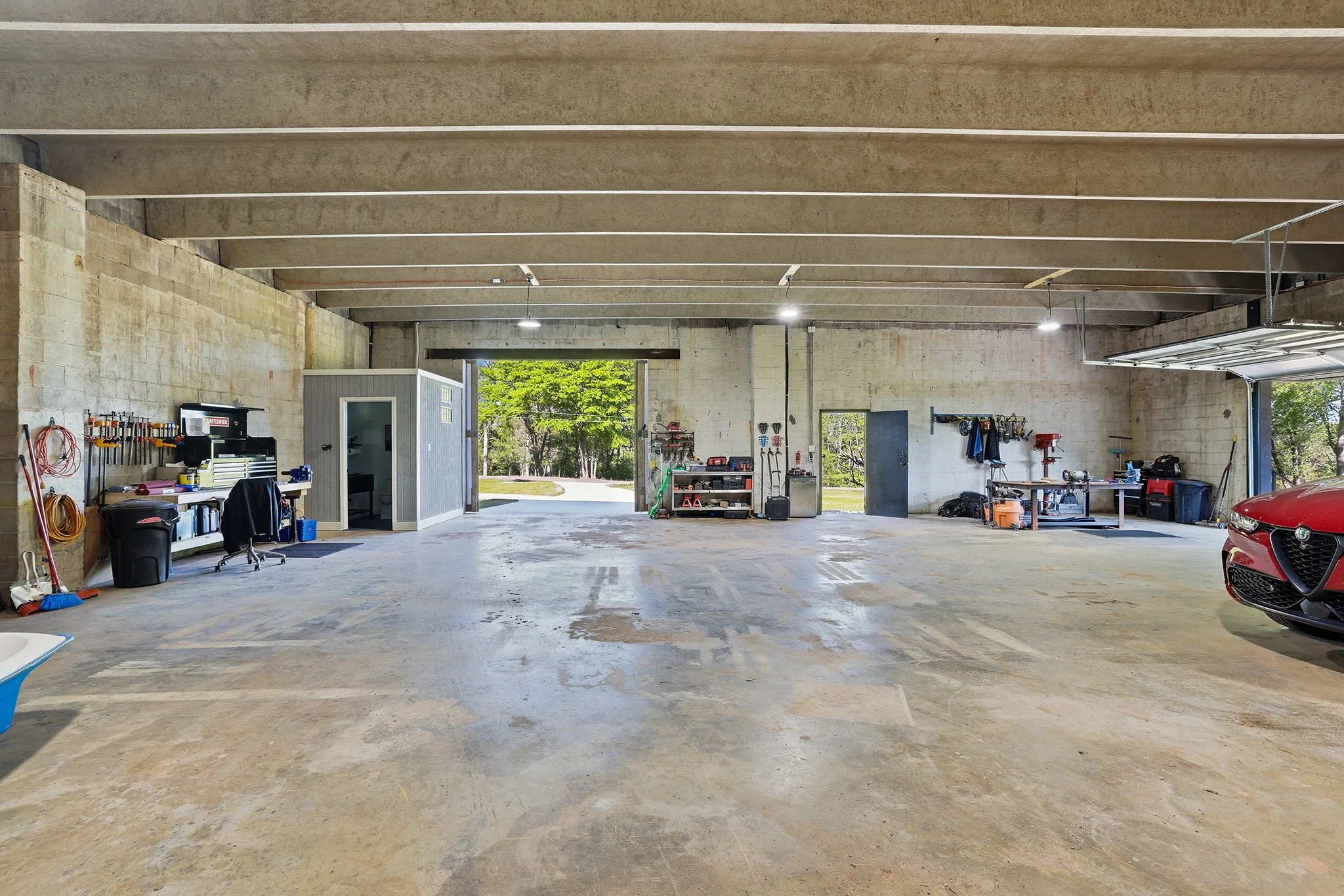A rear perspective from inside the warehouse, with a view of the great exterior walls of the newly renovated half-bath