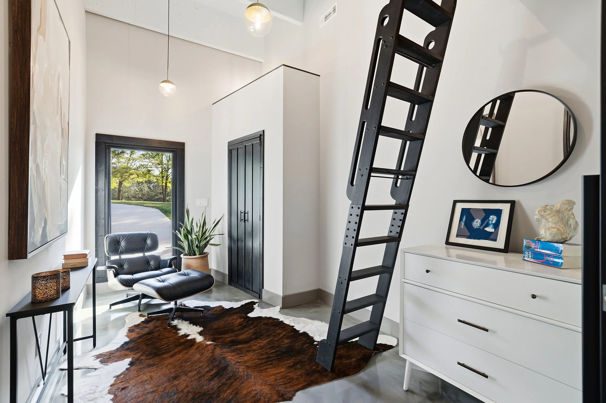 Downstairs loft bedroom with a large closet and flexible space ideal for a turnkey office or guest area