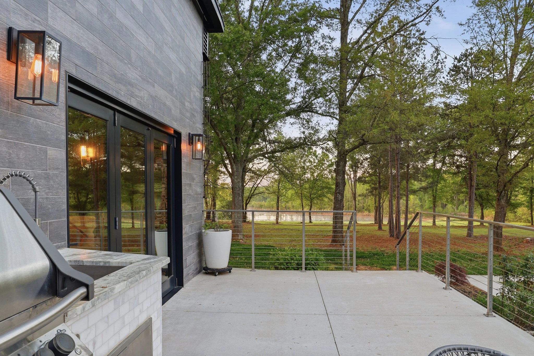 The back deck offers stunning views of nature — turkeys, deer, and abundant birds roam freely, and nearly daily sightings of herons and ospreys