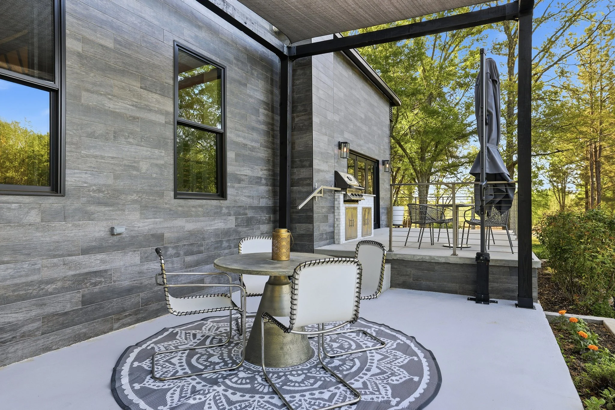 Lower patio dining area is perfect for summer breakfasts alfresco
