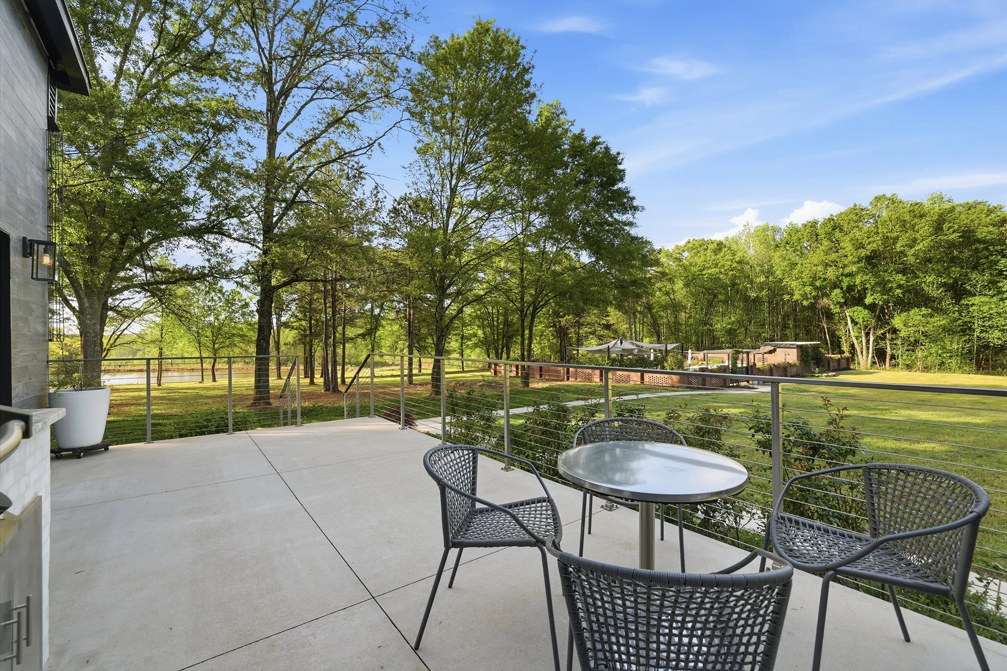 Upper patio dining area is perfect for sipping a cocktail while the grill master works