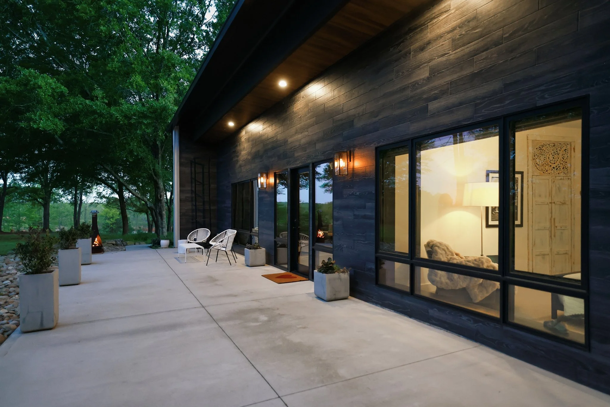 A compact chiminea offers the perfect touch of warmth to a the beautiful lounge area
