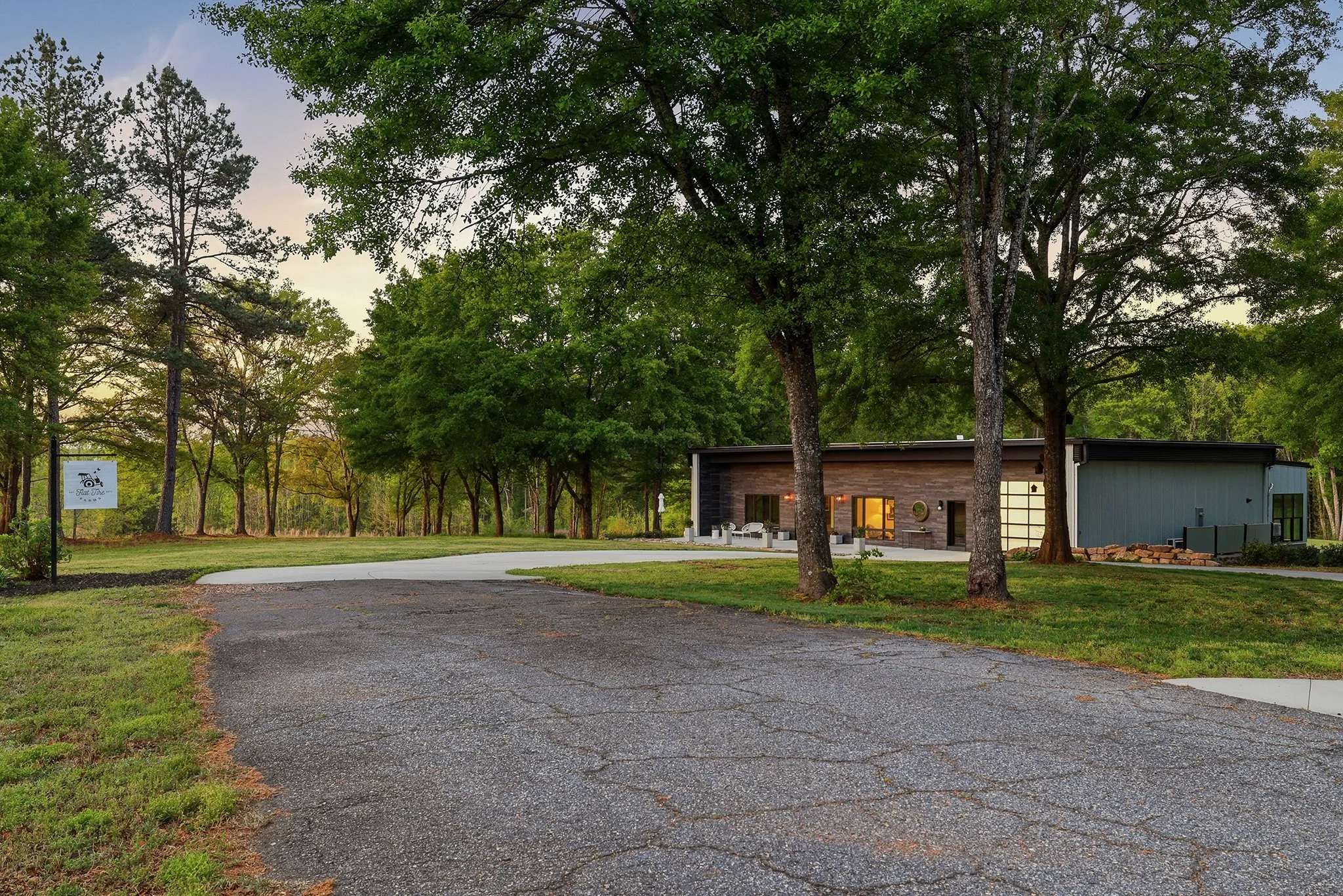 Enjoy the smooth transition from the county road to the concrete circular driveway, no mud, no gravel