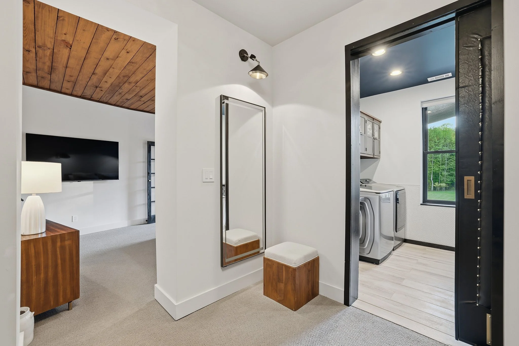 The laundry room connects on its west wall to the garage