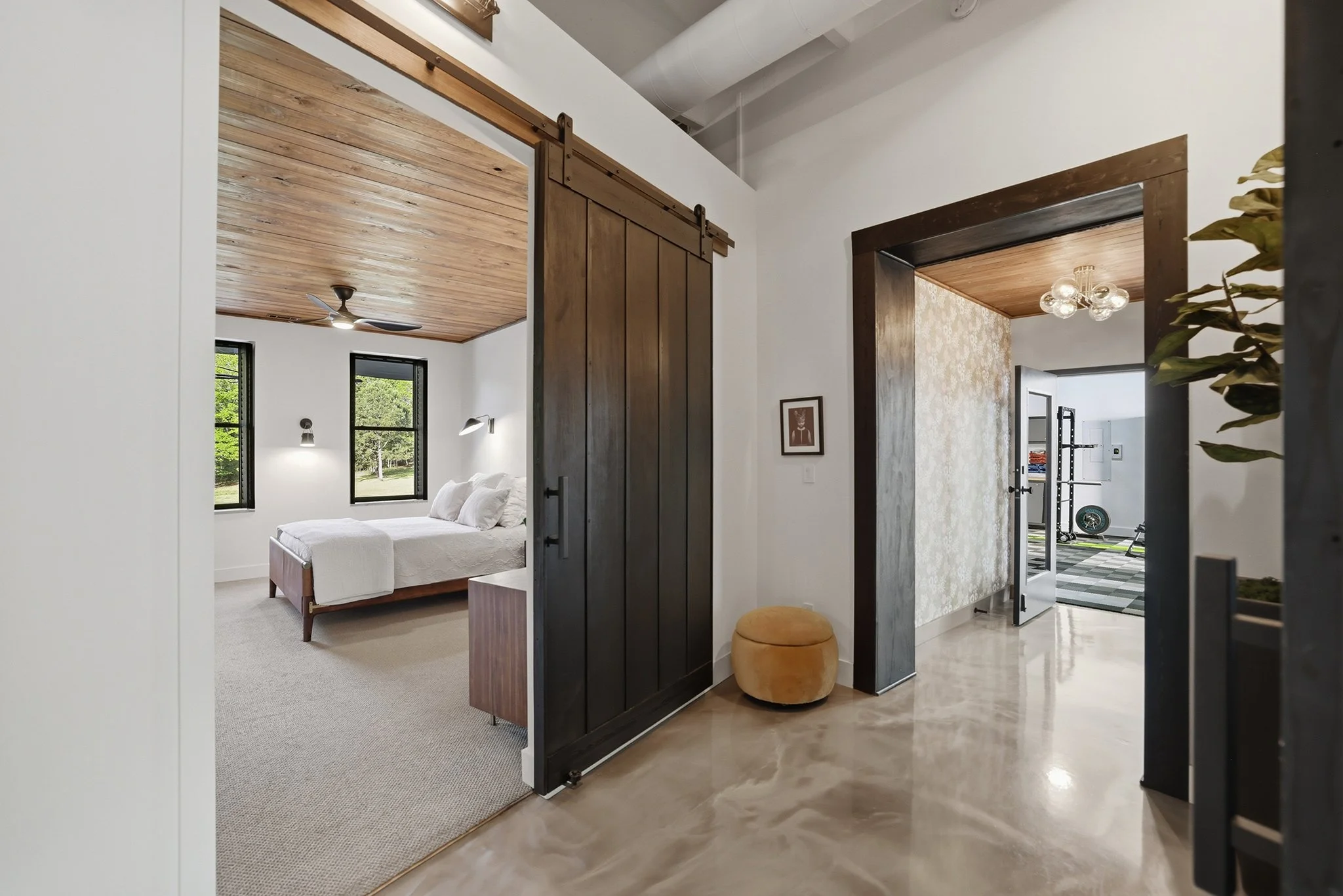 Custom eight-foot tall barn doors, weighing over 300 pounds each, and rich solid wood casements add a sense of permanency