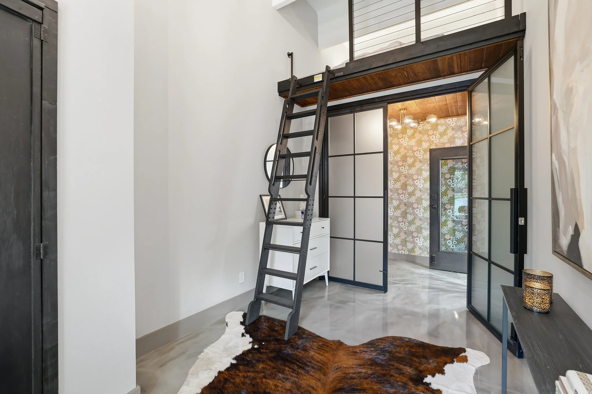Take the loft ladder to the upper bedroom platform